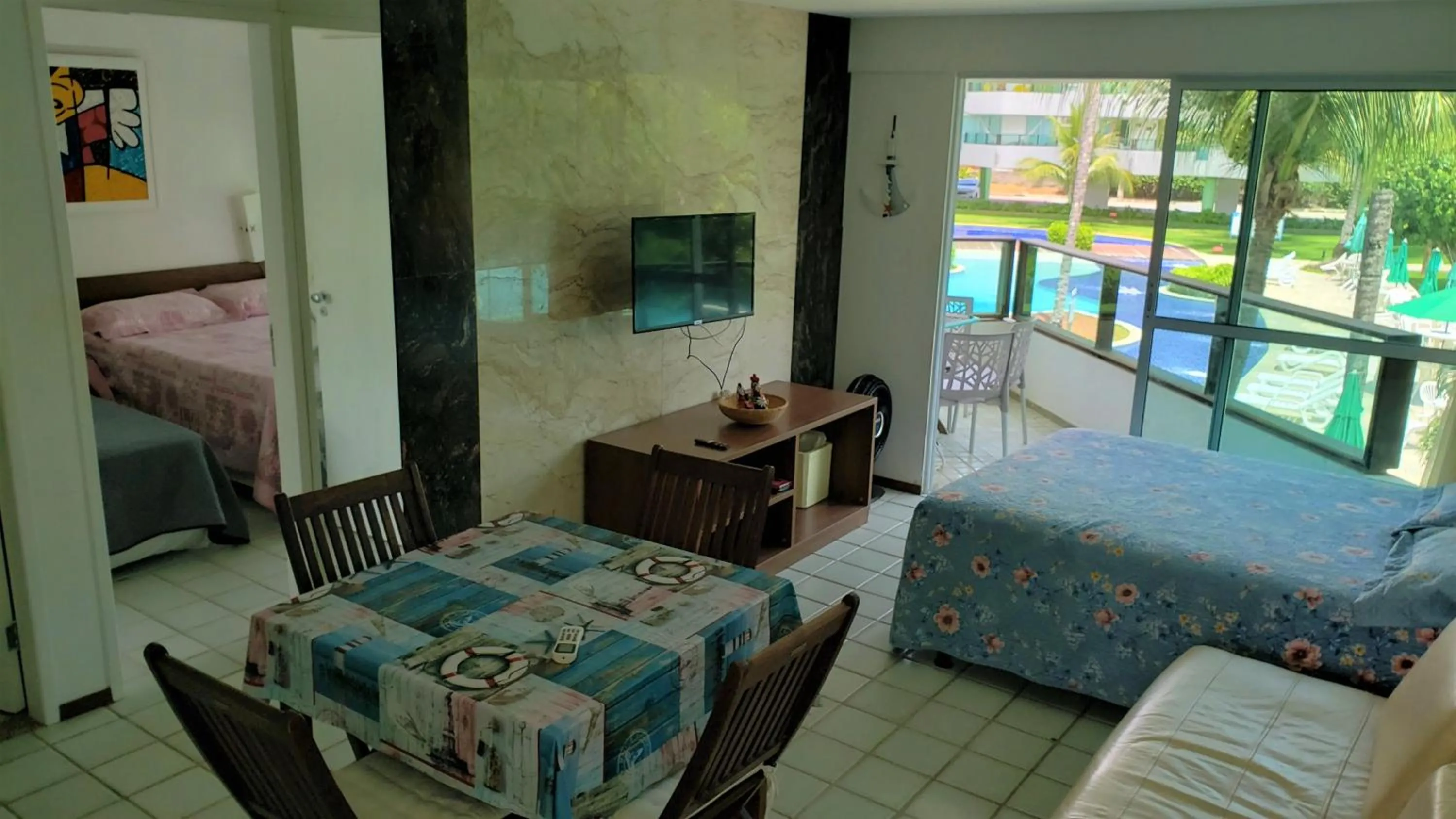 Living room, Bed in Ancorar Resort Frente Mar - Flat 6103