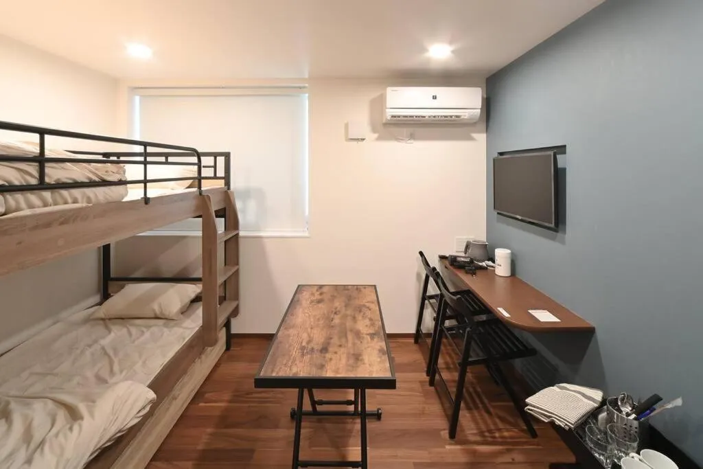 Bed in Stylewood Nishi-Shinjuku by Tranova