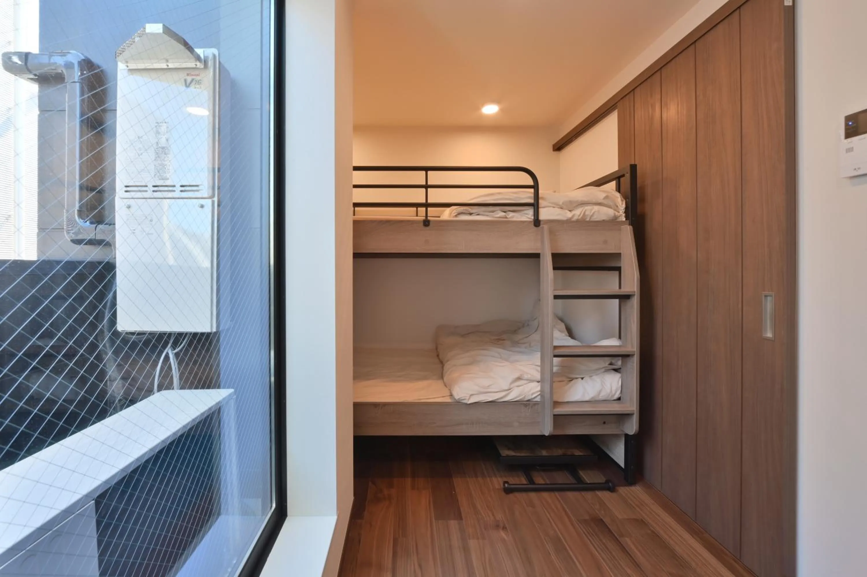 Bed in Stylewood Nishi-Shinjuku by Tranova