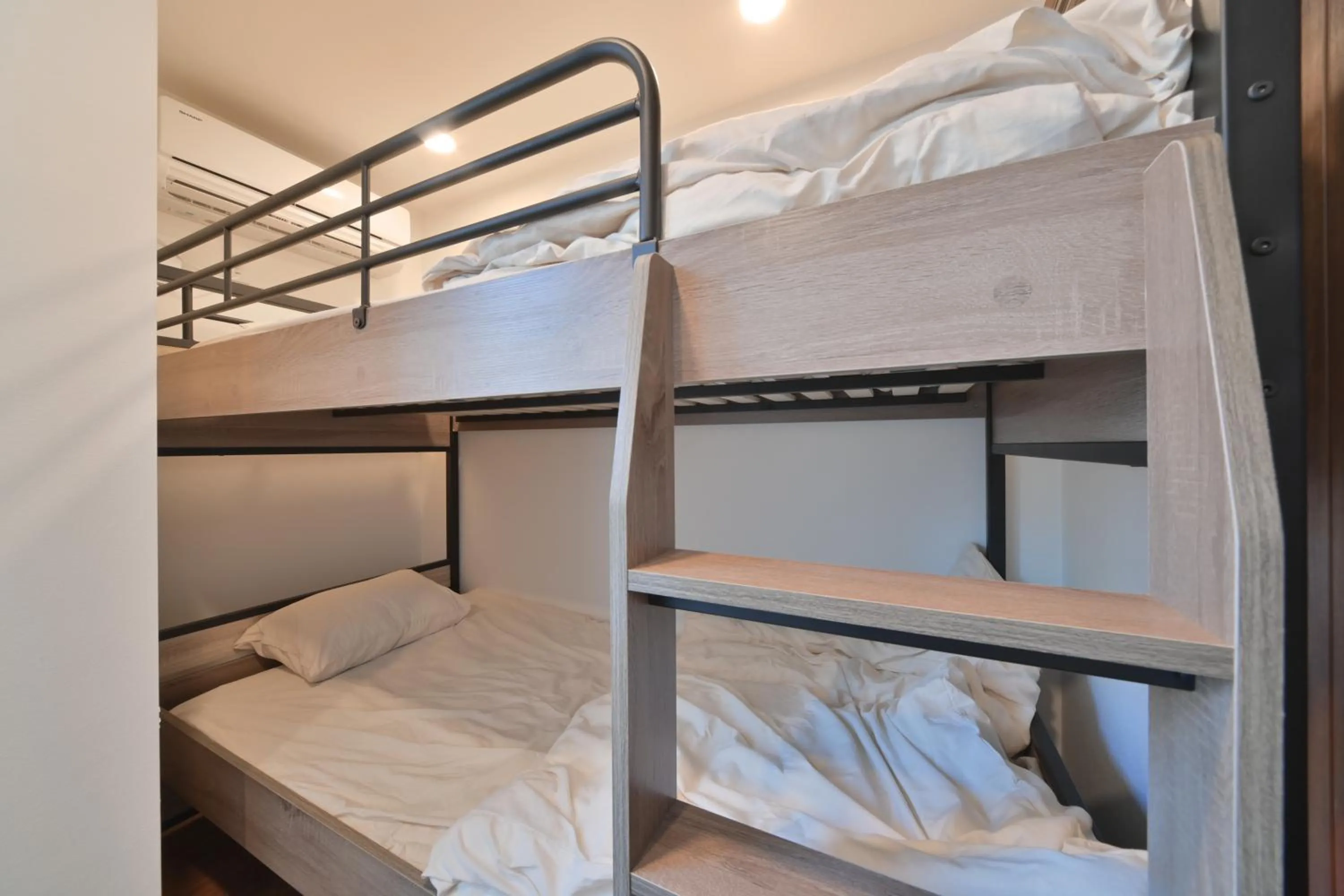 Bed in Stylewood Nishi-Shinjuku by Tranova