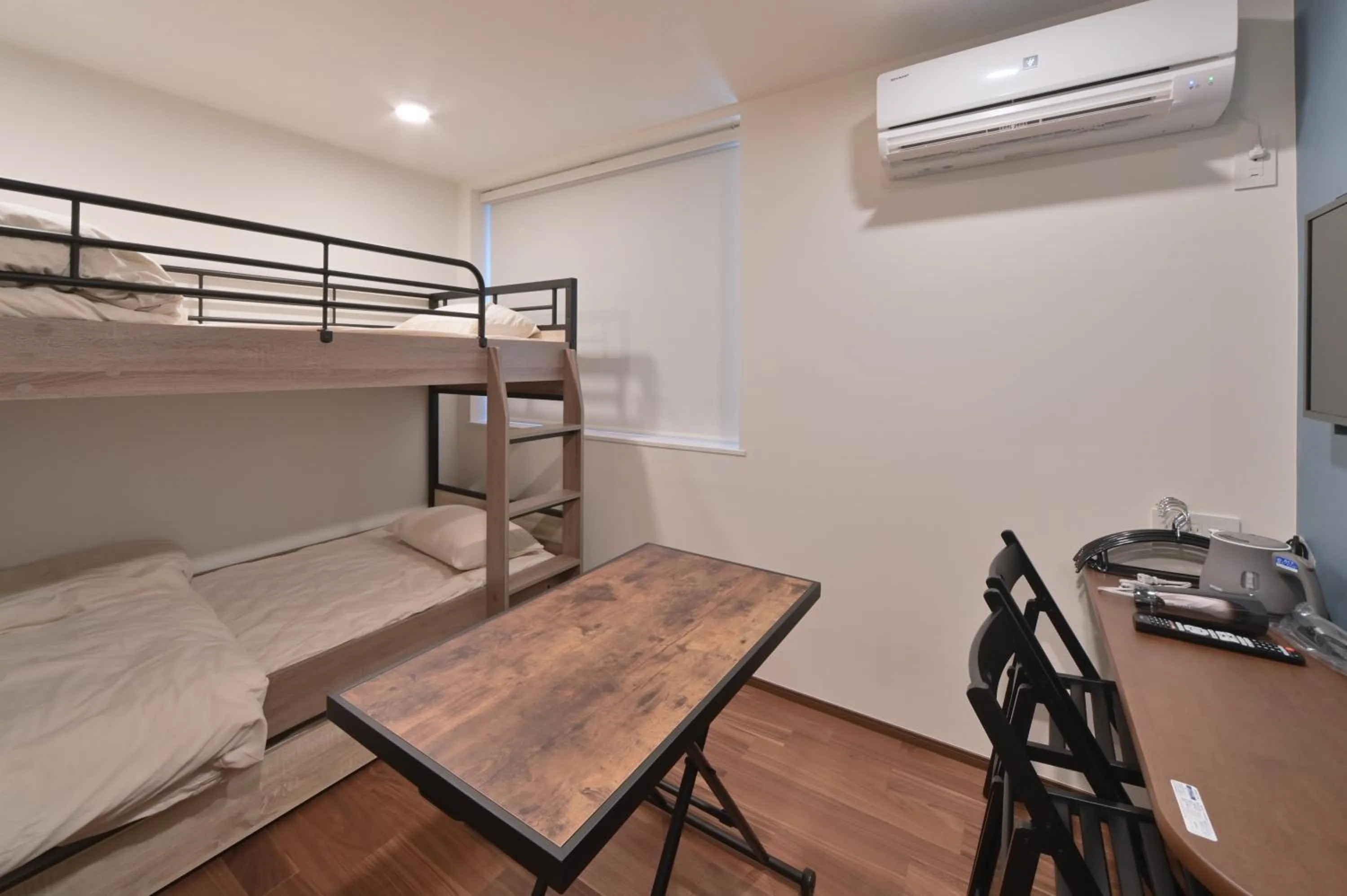 Bed in Stylewood Nishi-Shinjuku by Tranova