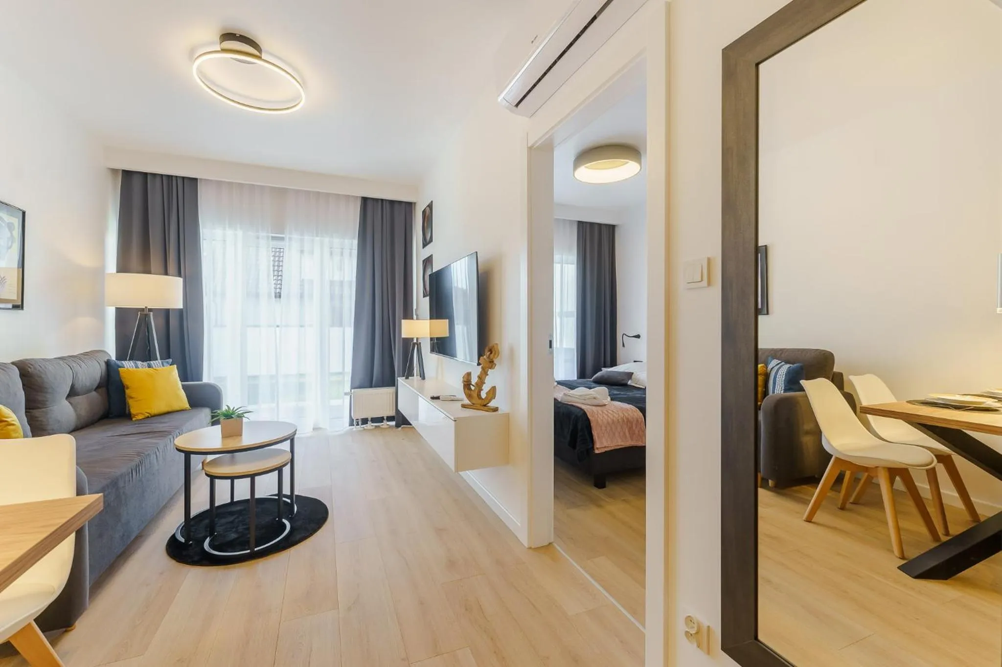 Communal lounge/ TV room, Bed in Ustronie Apartments 20 m do plaży