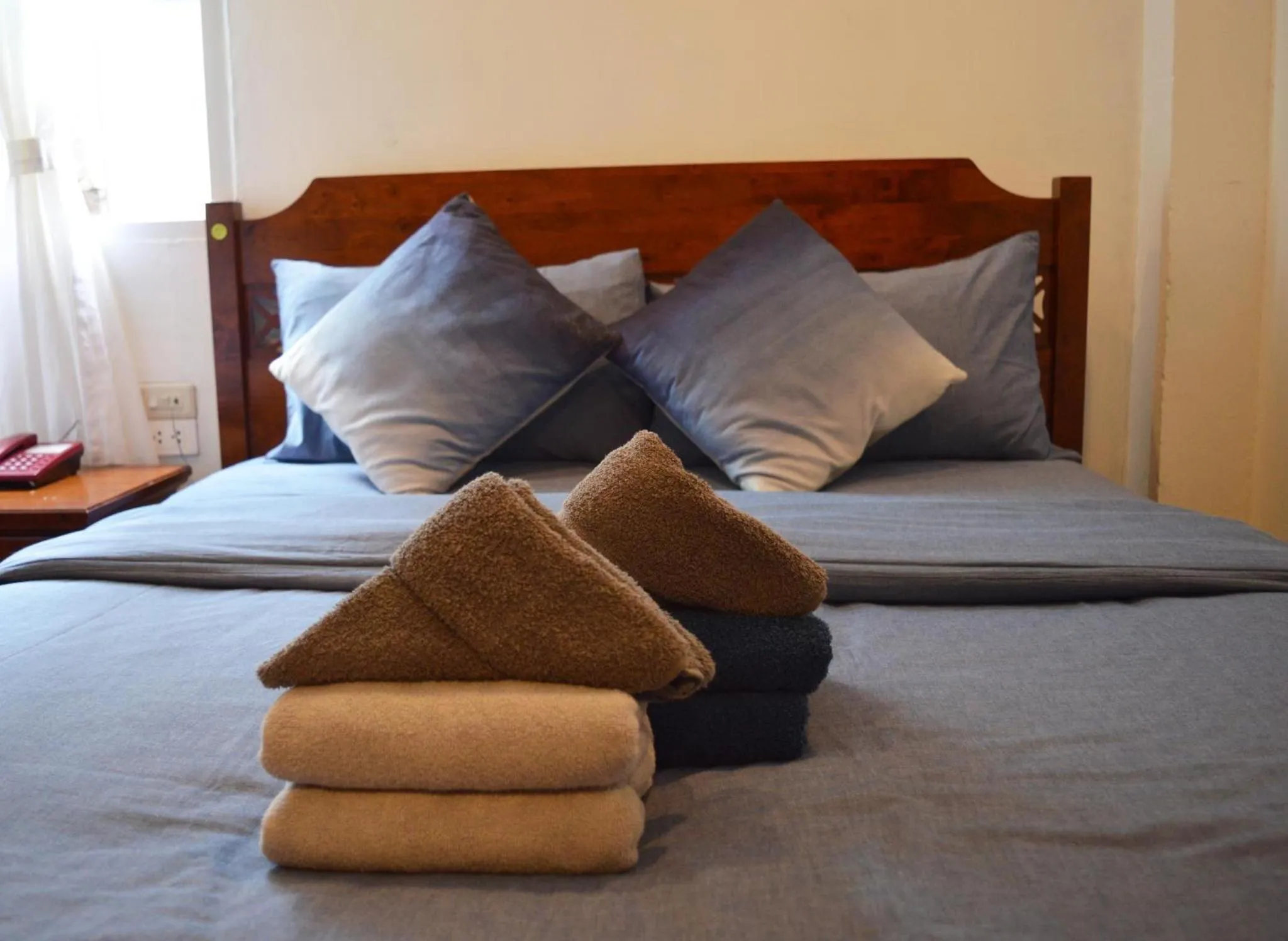 Bed in De Nawarat Chiangmai Boutique Apartment