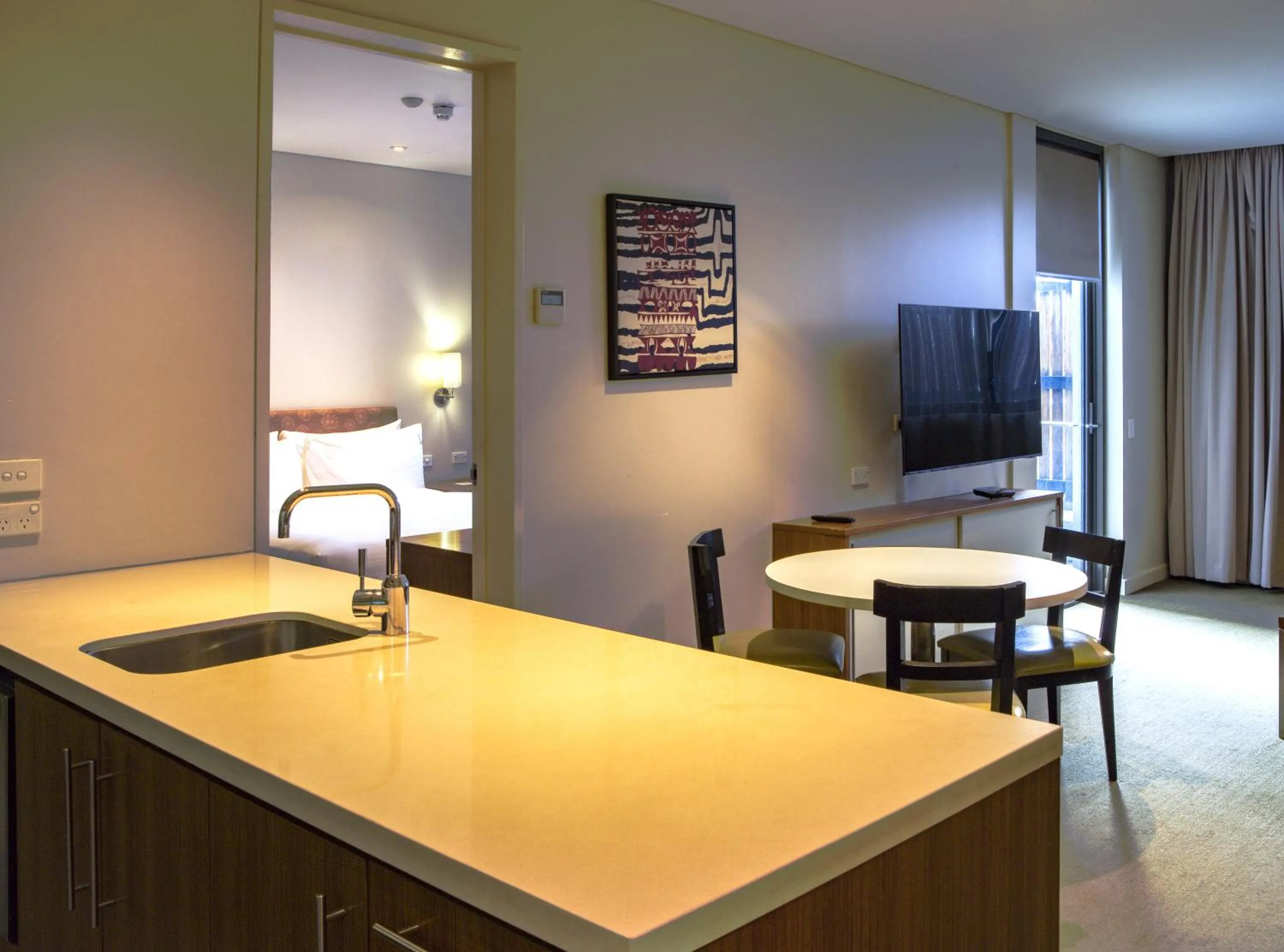 Communal lounge/ TV room in Holiday Inn & Suites Port Moresby by IHG