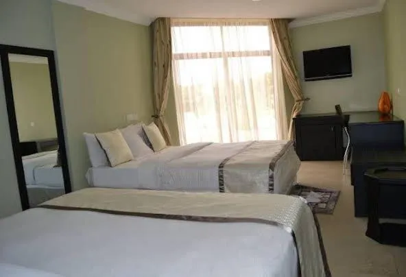 Living room, Bed in Panone Hotel-Chekereni