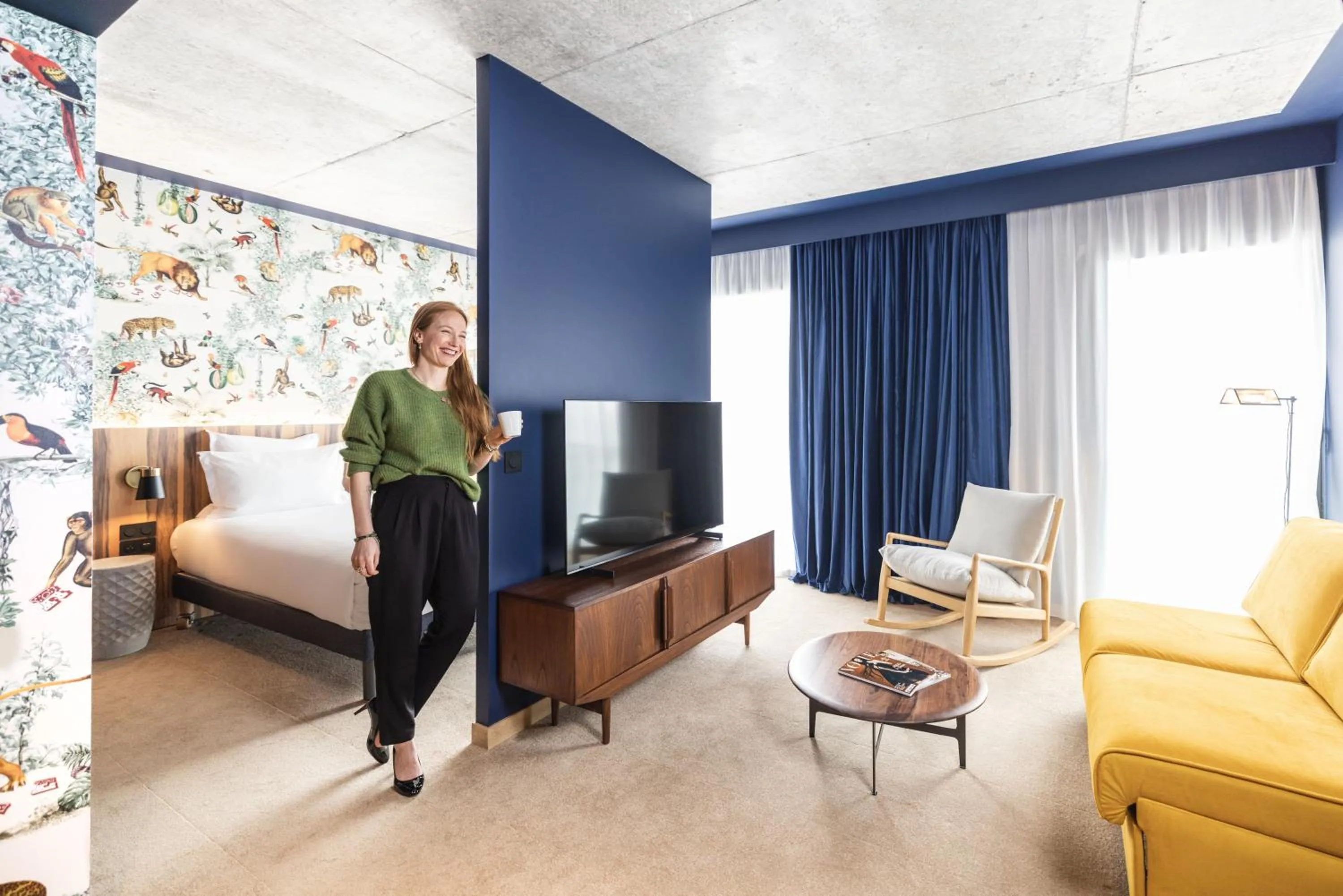 Living room, Bed in KOPSTER Hotel Residence Paris Ouest Colombes