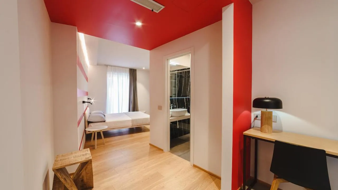 Seating area, Bed in Vietti Apartments