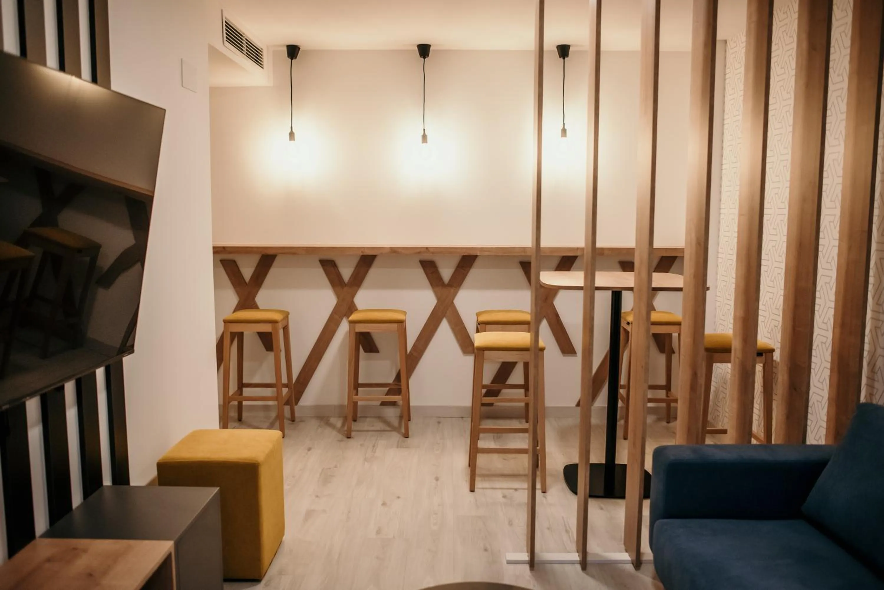 Communal lounge/ TV room in Hotel Lux Melide