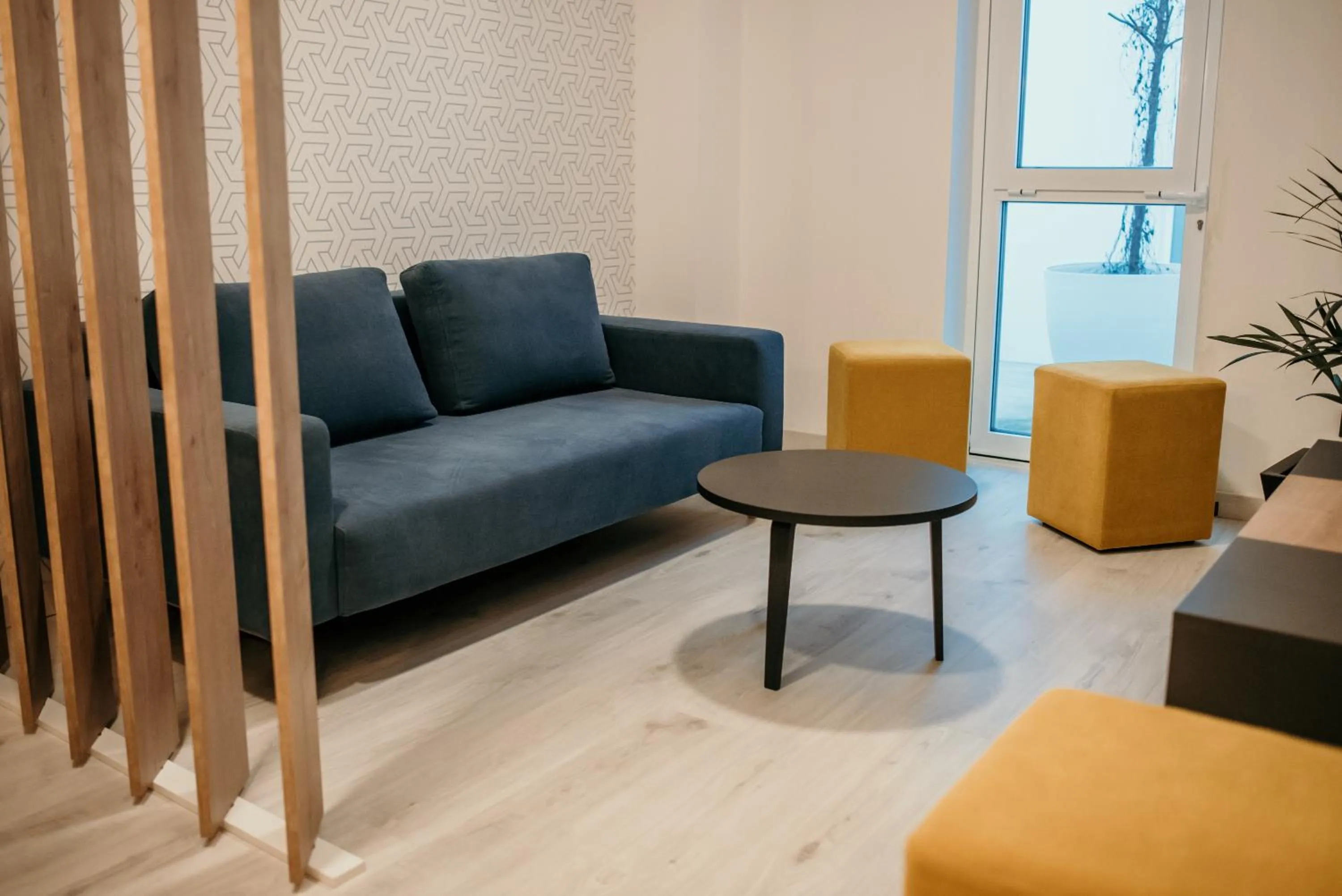 Communal lounge/ TV room in Hotel Lux Melide