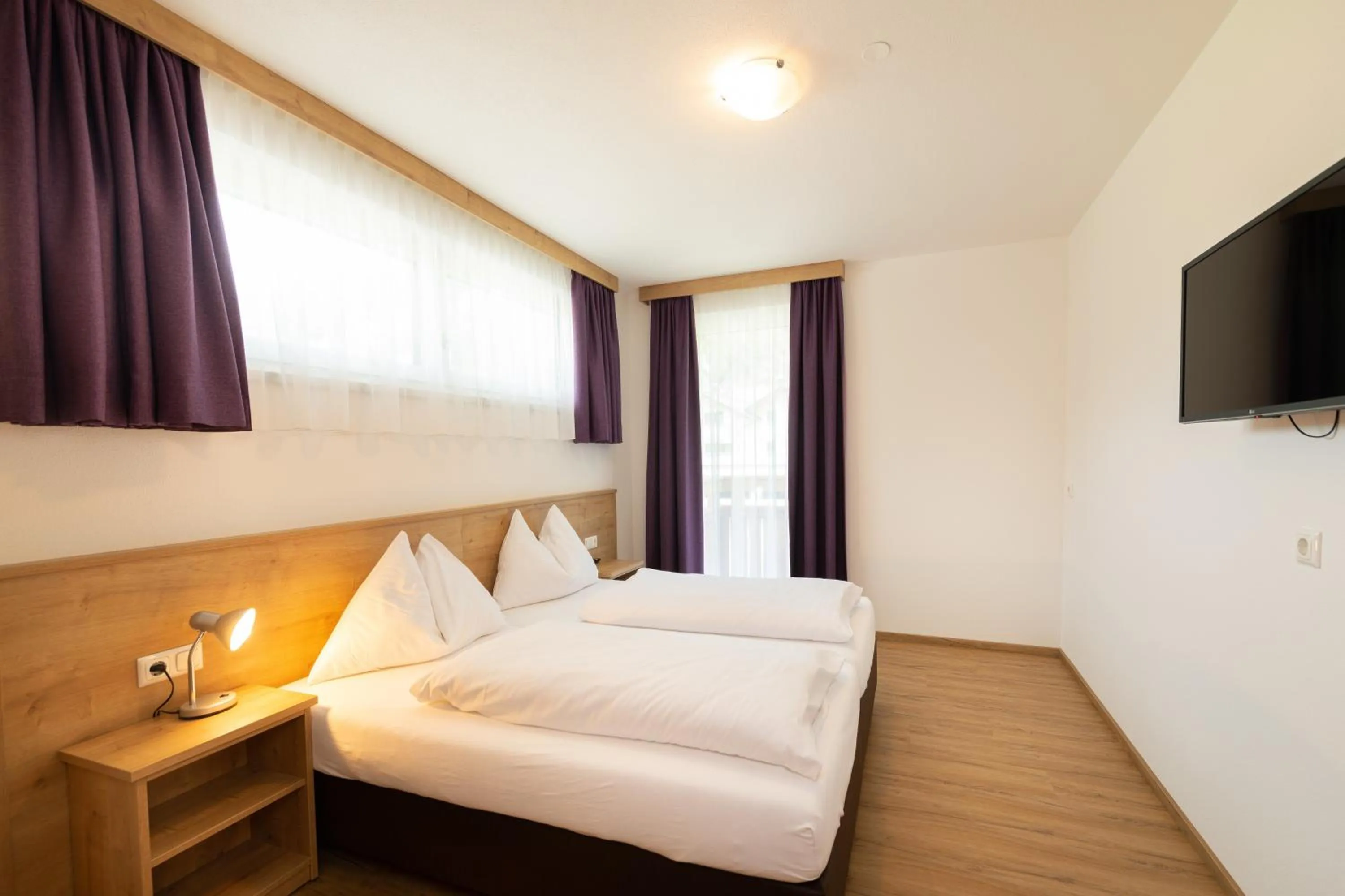 Bed in Hotel-Pension Egger
