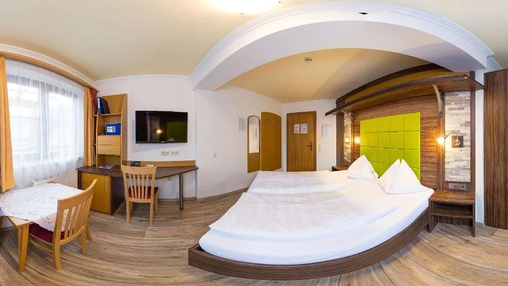 Bed in Hotel-Pension Egger