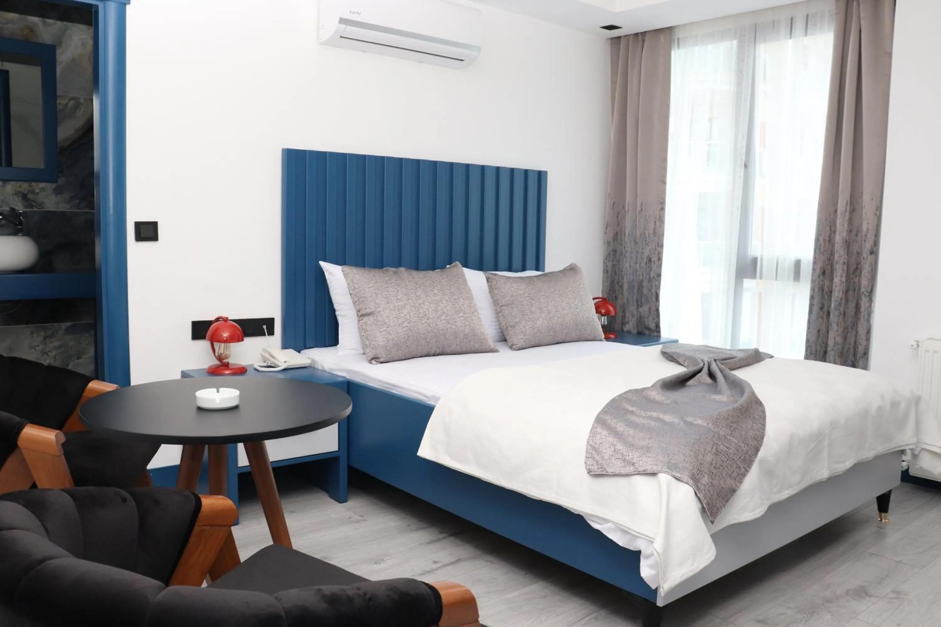 Bed in Blue Ay Boutique Hotel