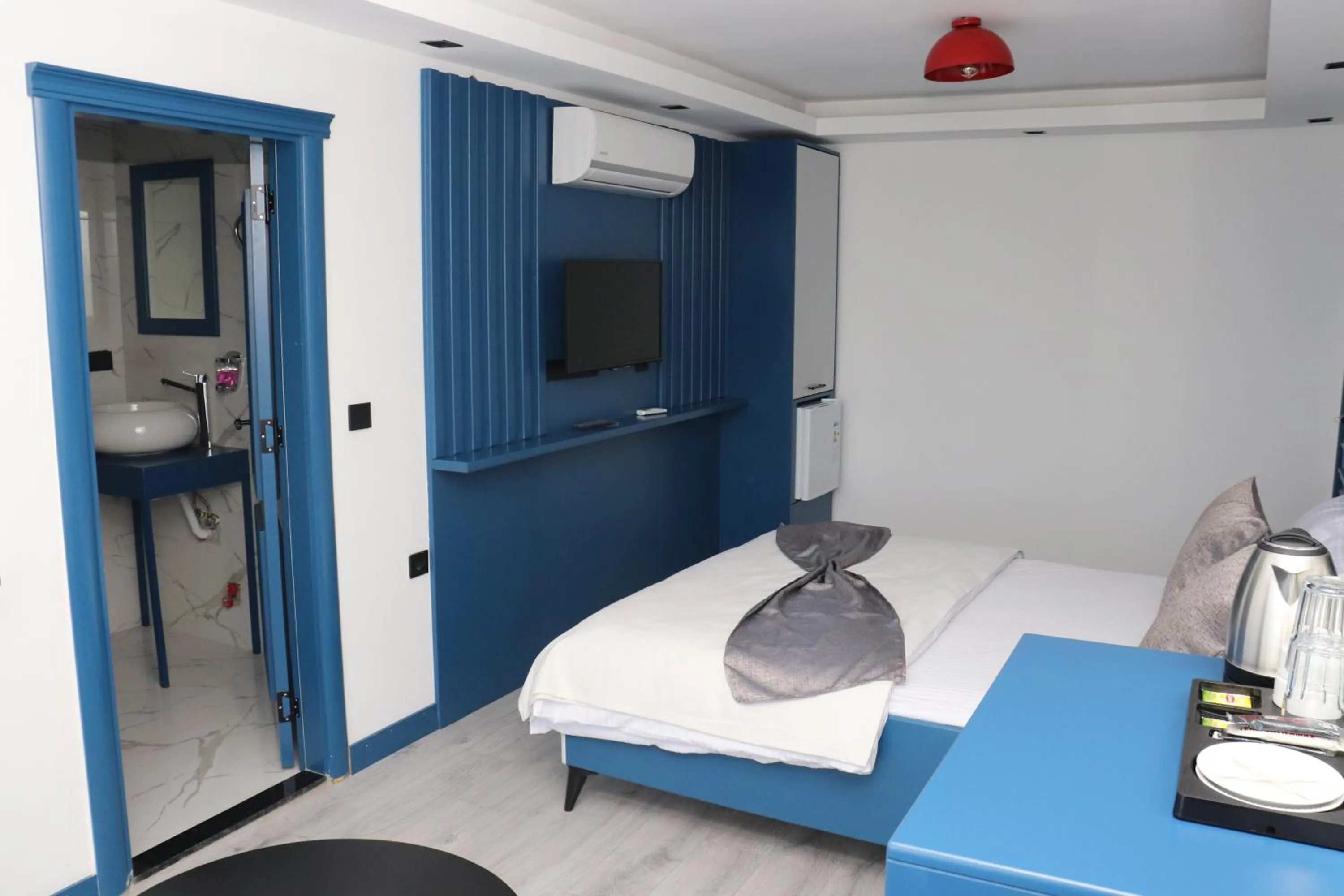 Bed in Blue Ay Boutique Hotel