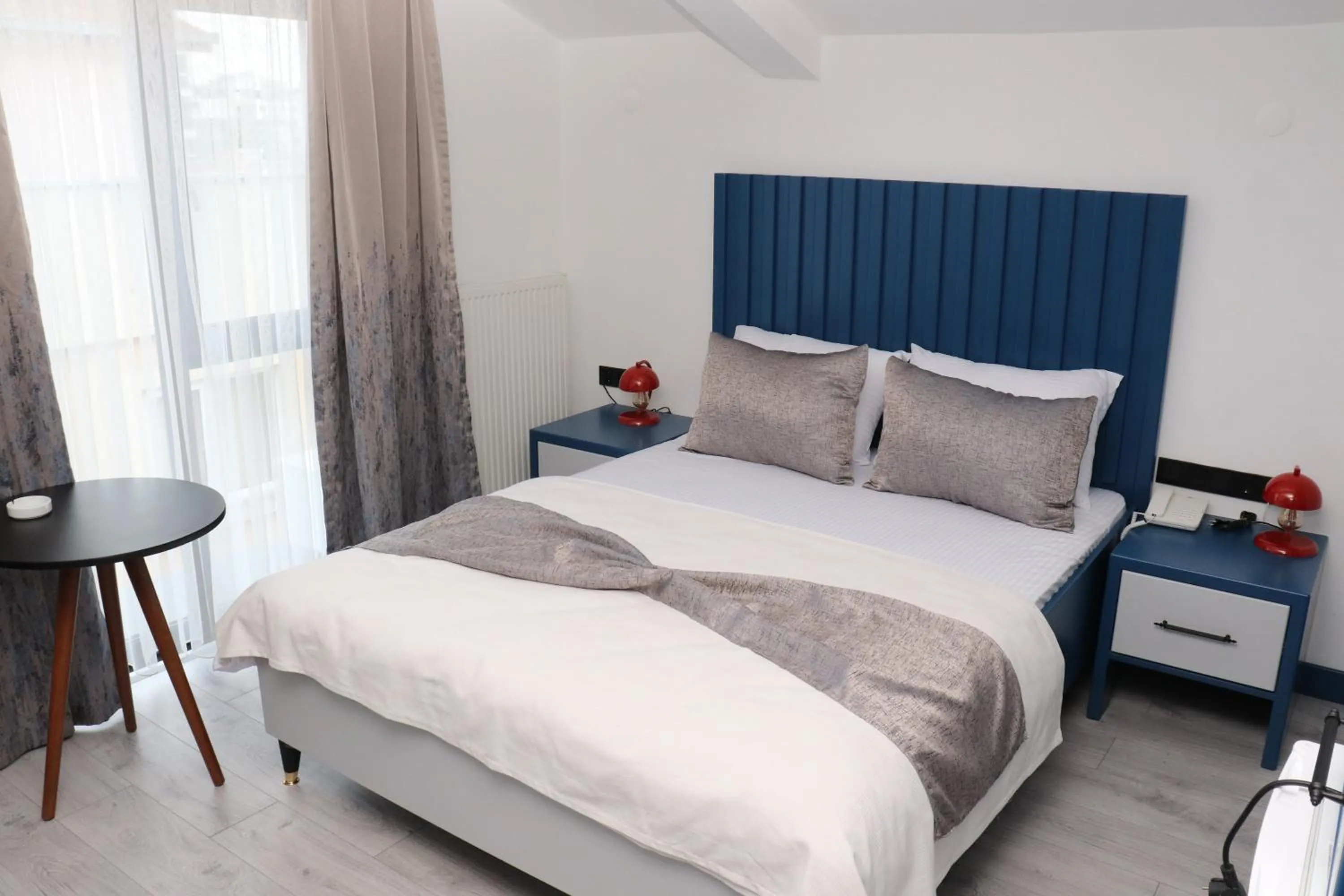 Bed in Blue Ay Boutique Hotel