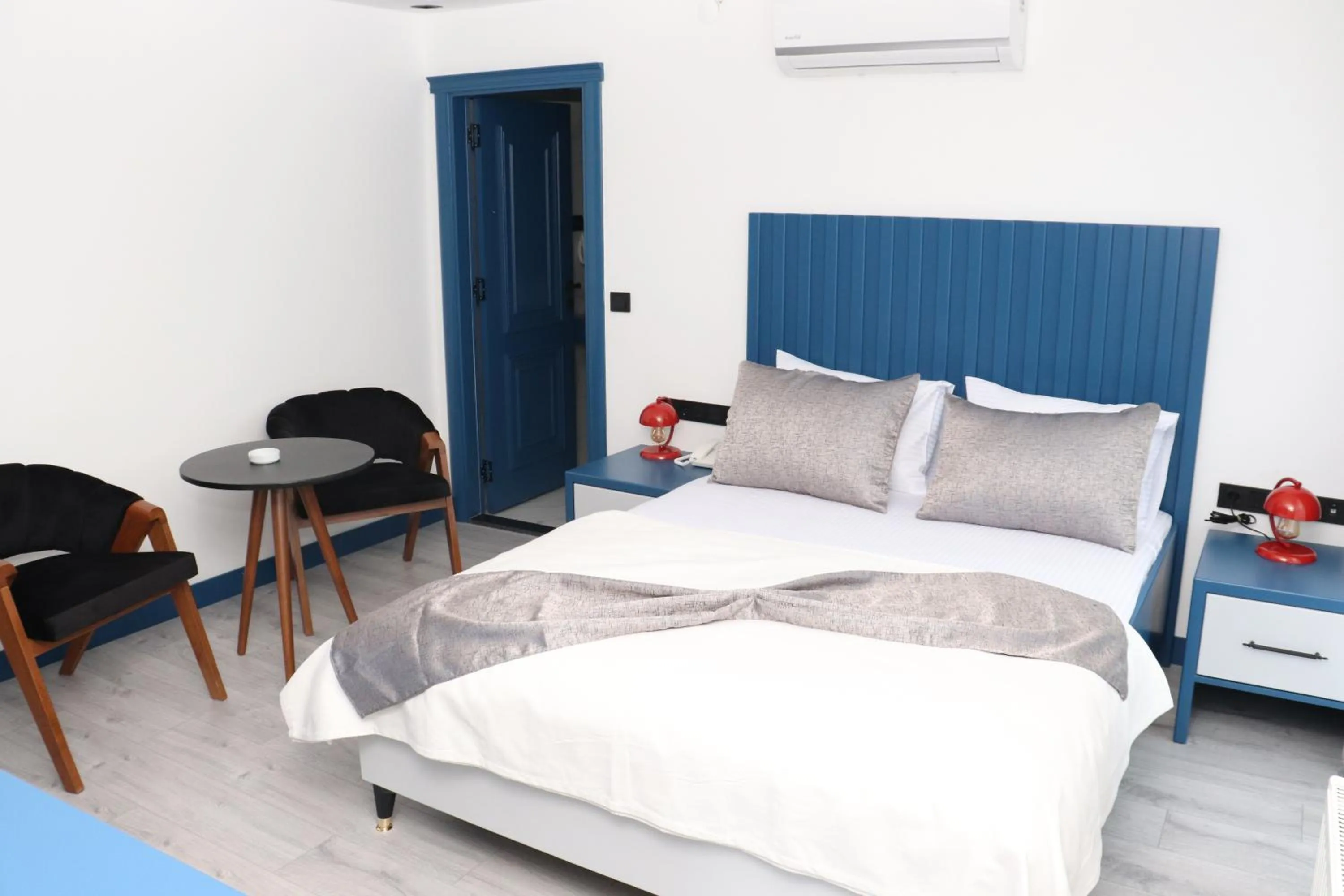 Bed in Blue Ay Boutique Hotel