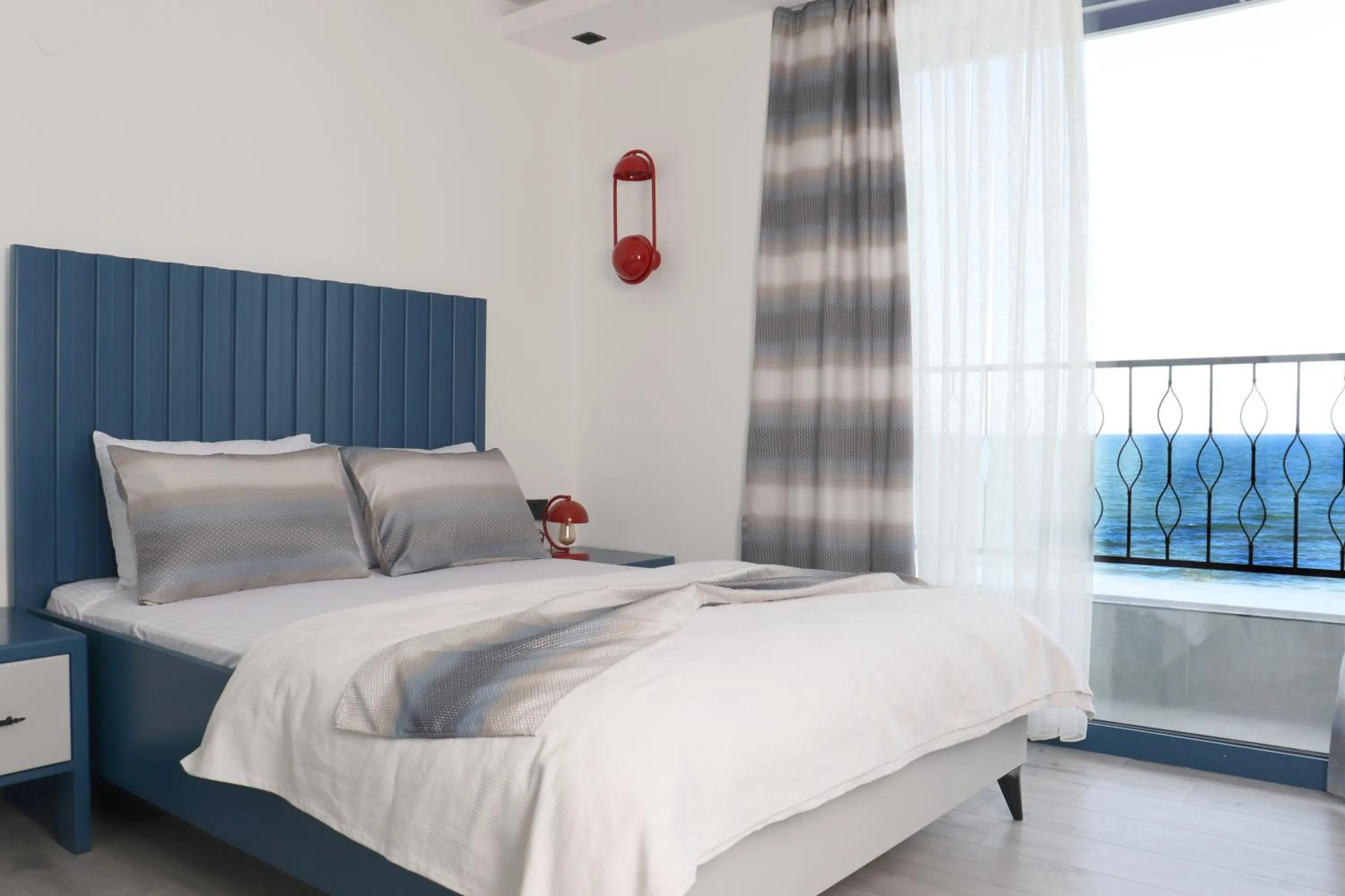 Bed in Blue Ay Boutique Hotel