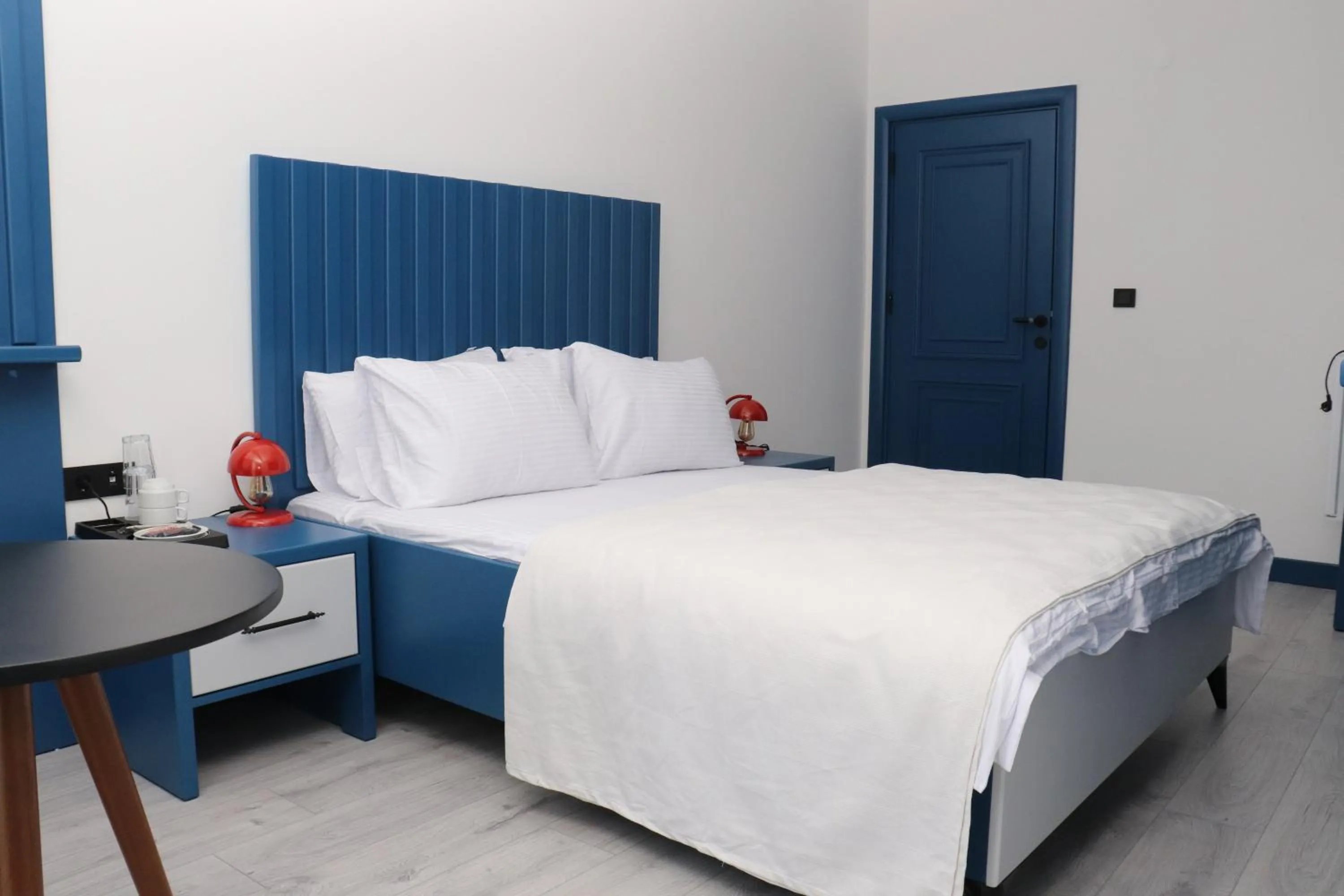 Bed in Blue Ay Boutique Hotel