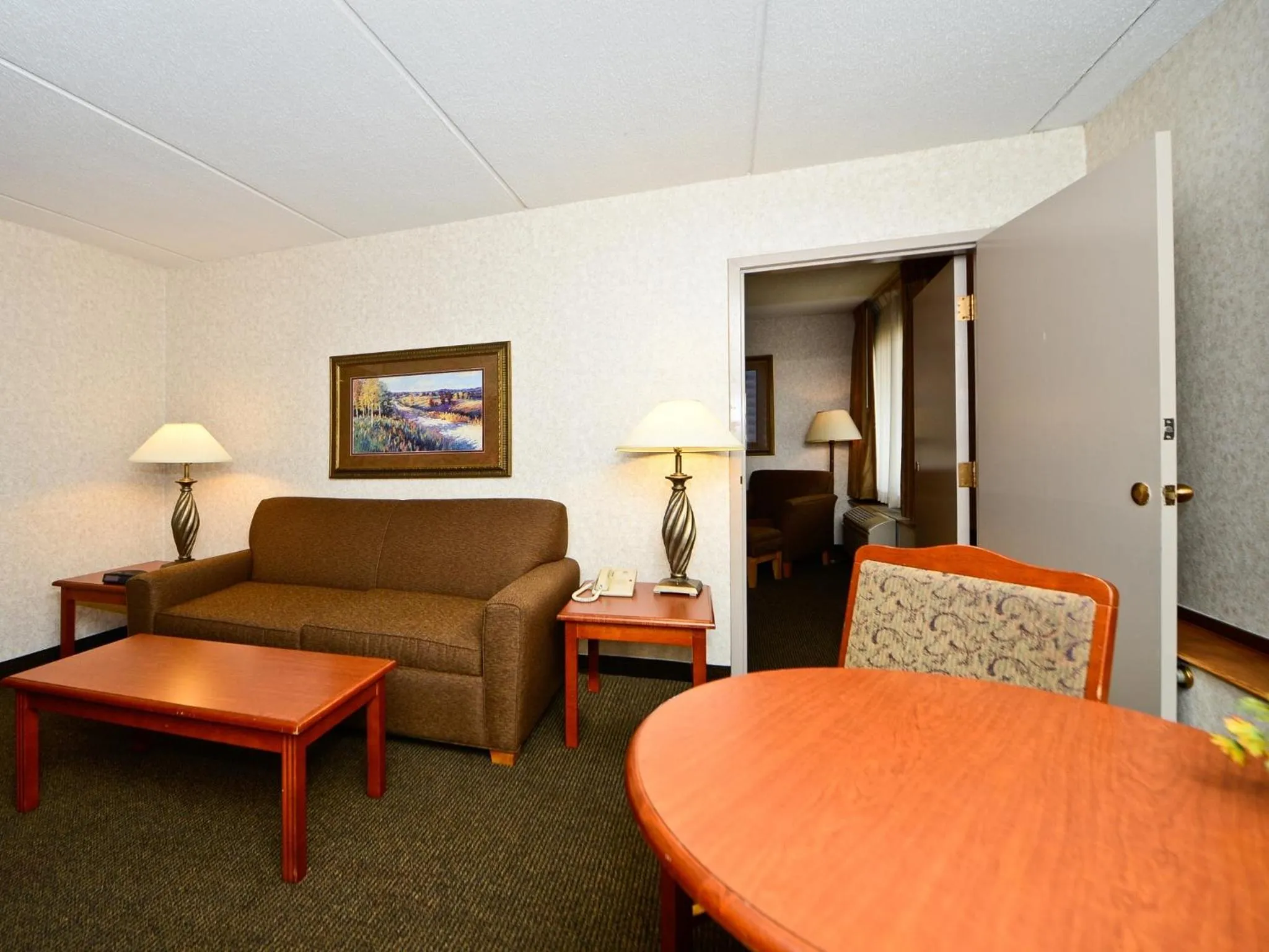 Living room in Ramada by Wyndham Plymouth Hotel & Conference Center