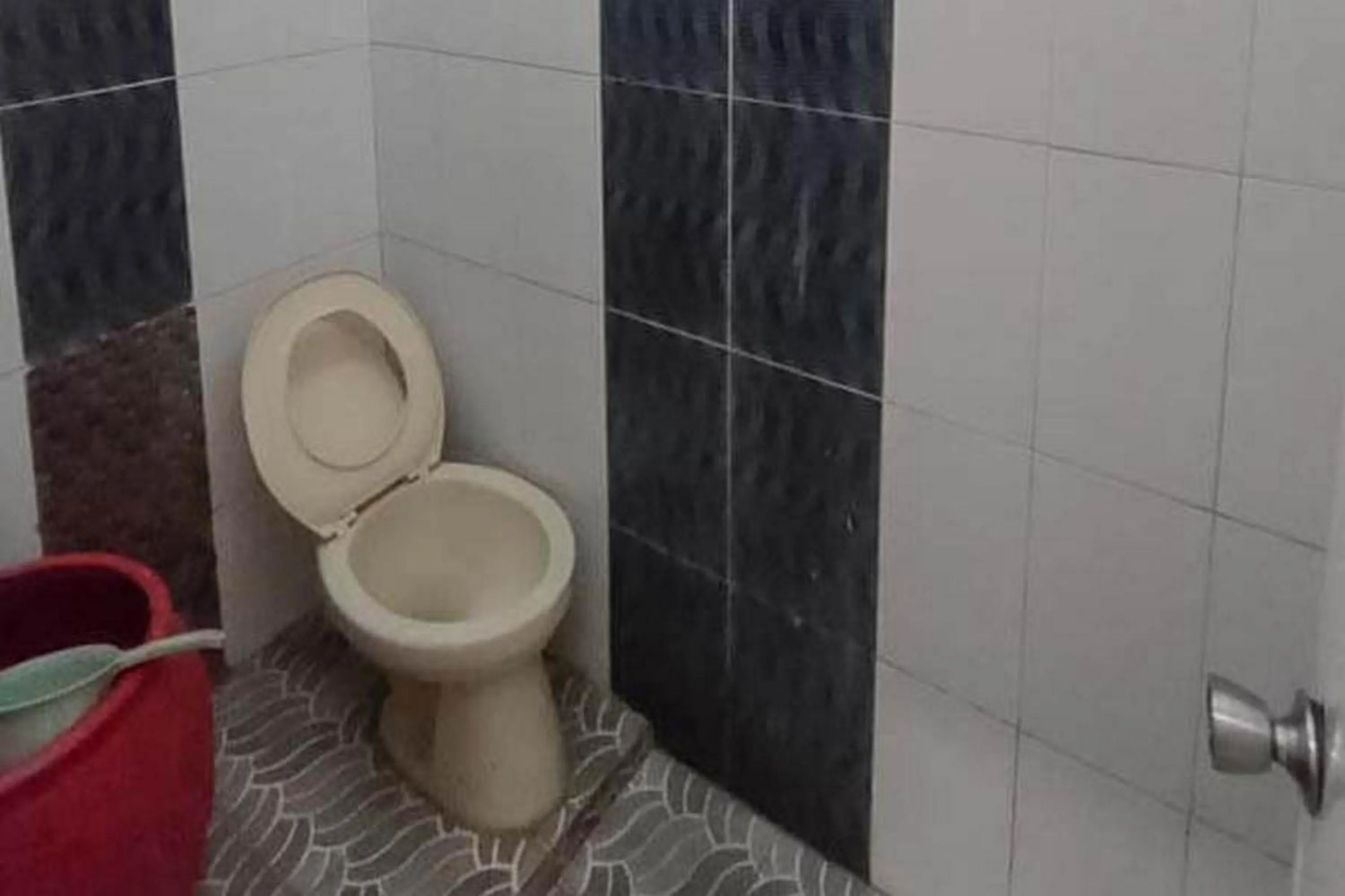 Bathroom in Villa Ghazani 4 at Desa Wisata Songgokerto