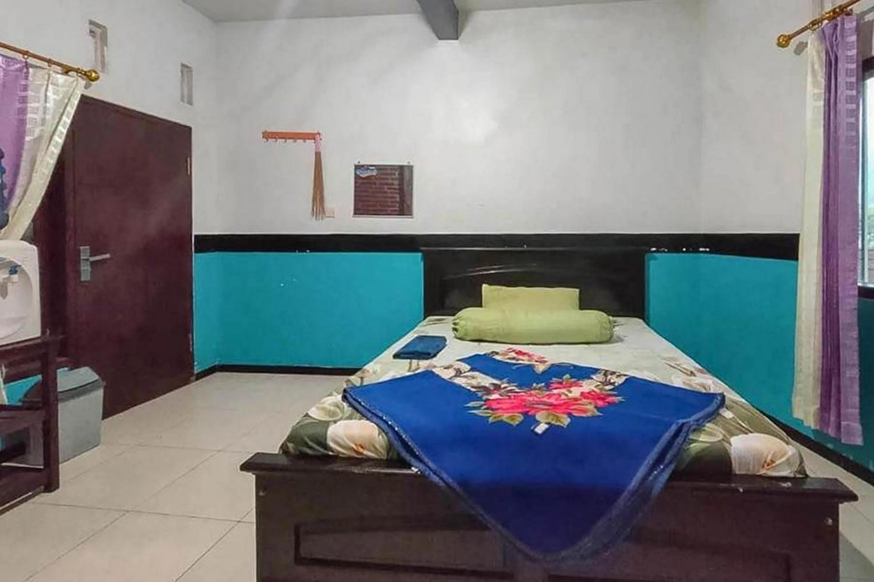 Bed in Villa Ghazani 4 at Desa Wisata Songgokerto