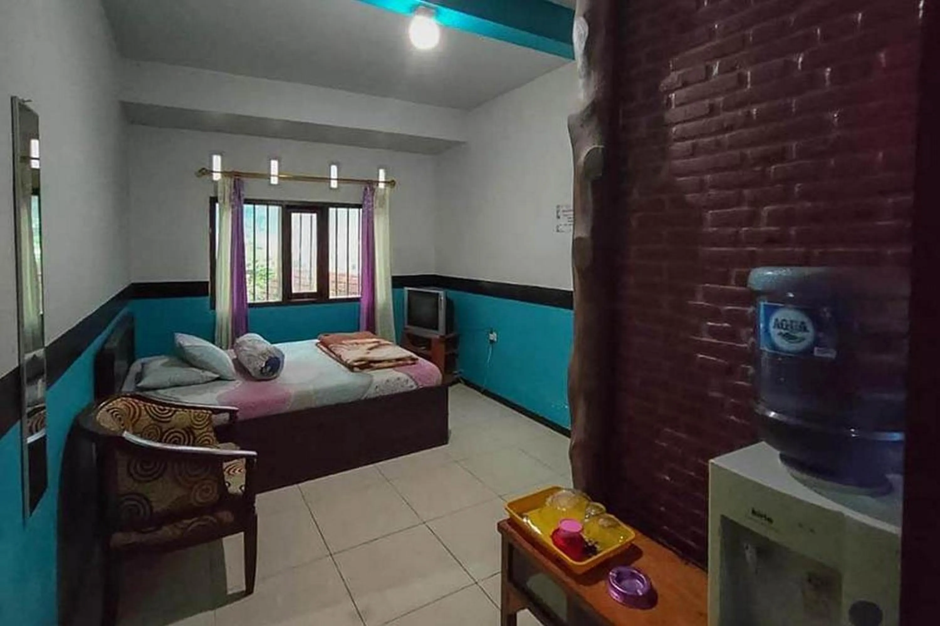 Bed in Villa Ghazani 4 at Desa Wisata Songgokerto