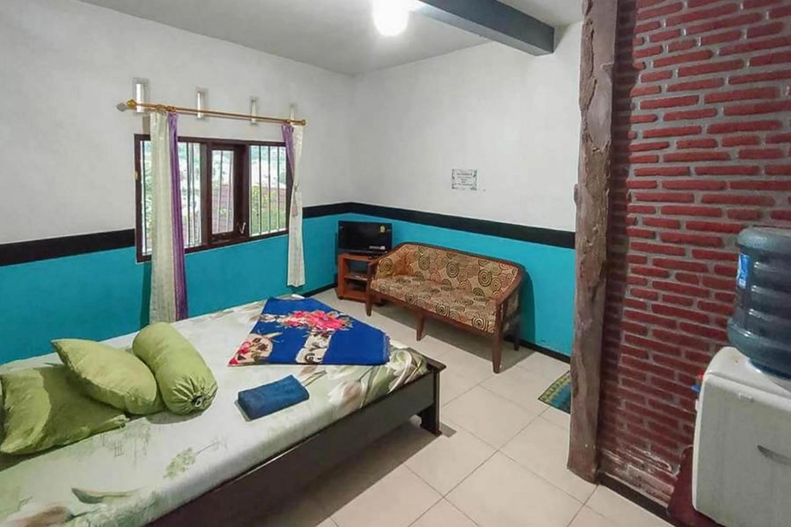 Bed in Villa Ghazani 4 at Desa Wisata Songgokerto