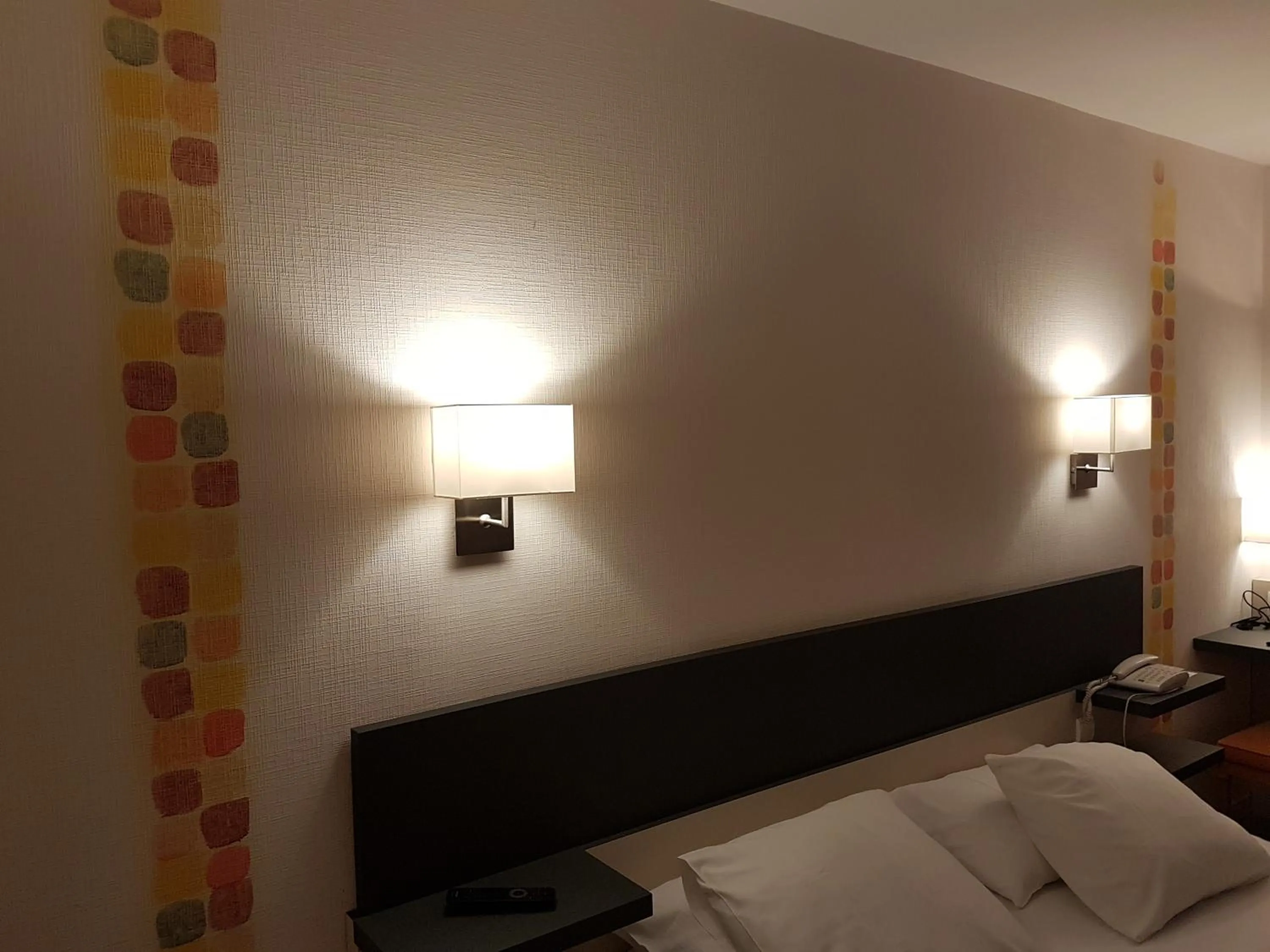 Decorative detail, Bed in Logis Hôtel Restaurant Le Dauphin et Le Spa du Prieuré