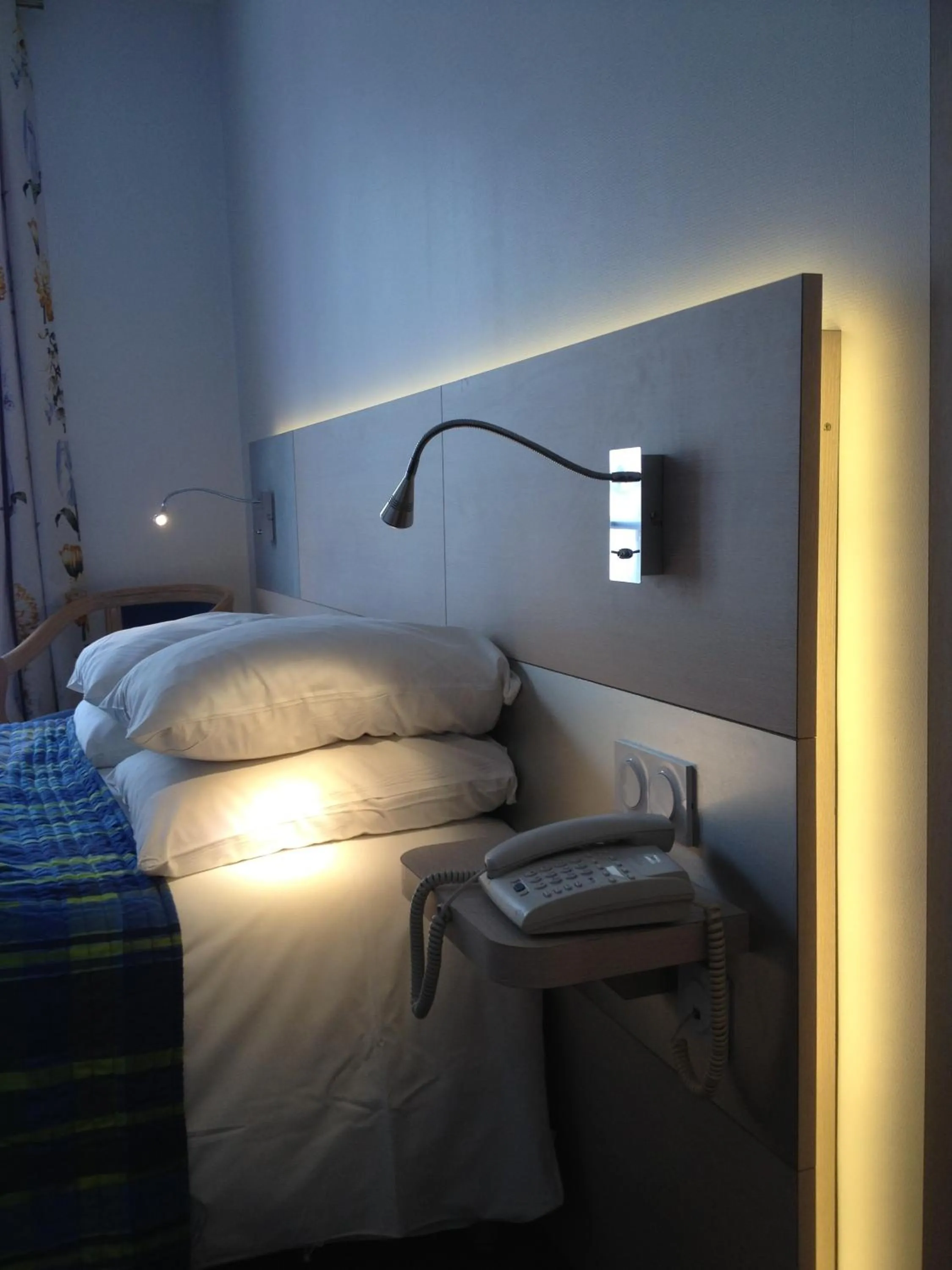 Decorative detail, Bed in Logis Hôtel Restaurant Le Dauphin et Le Spa du Prieuré