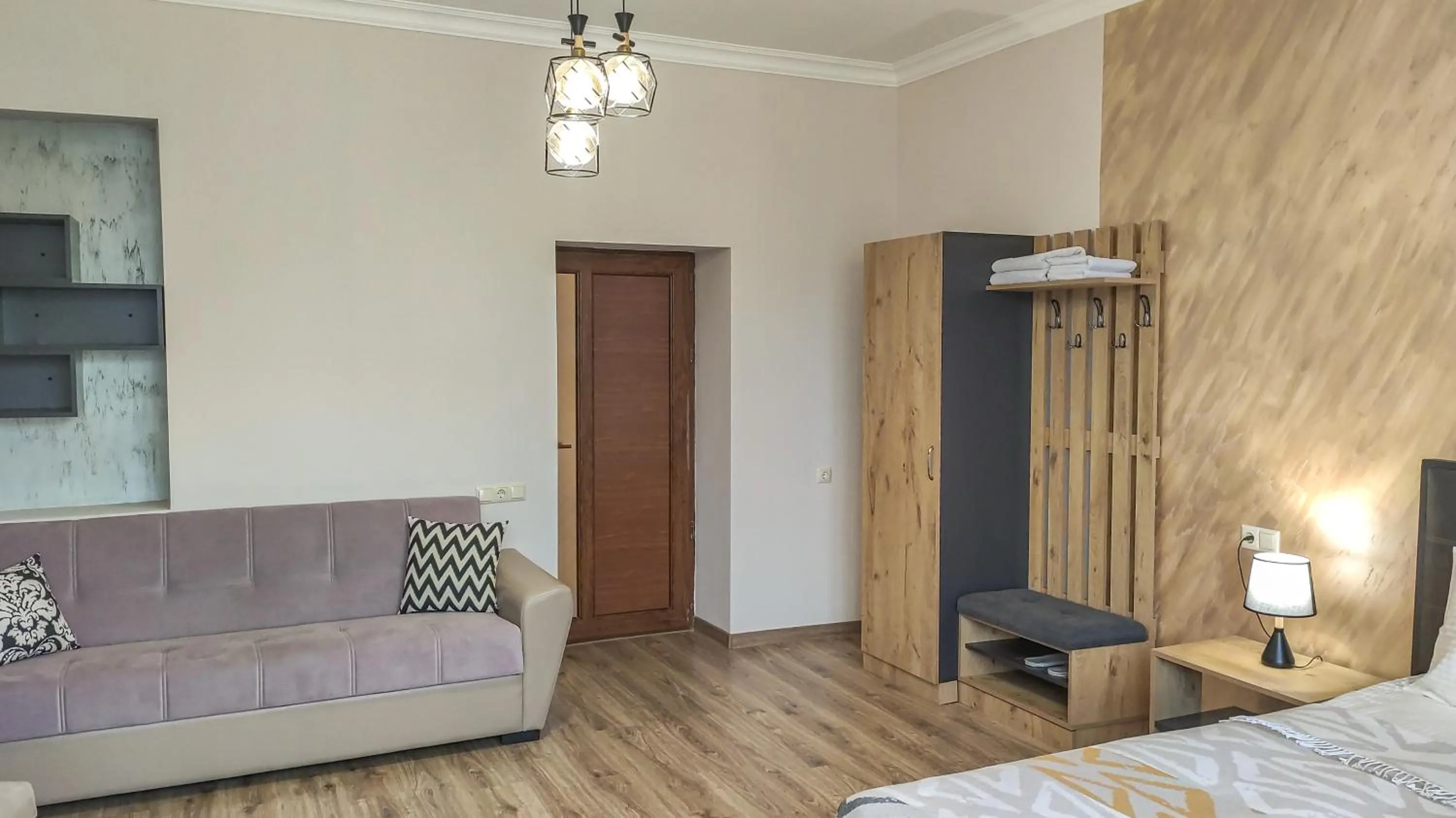 Communal lounge/ TV room, Bed in Harmonia Garden GastroYard&Hotel