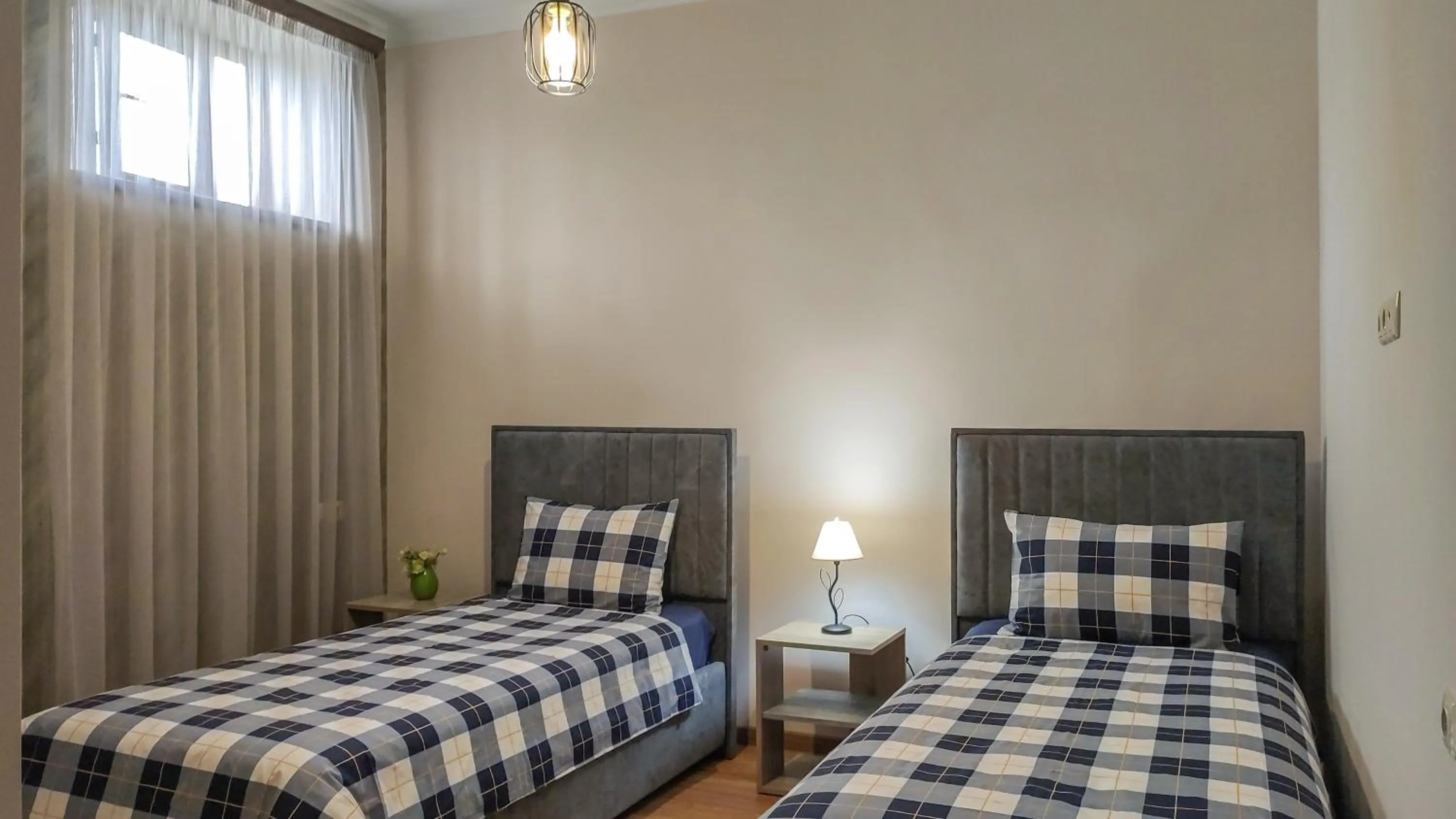 Bed in Harmonia Garden GastroYard&Hotel