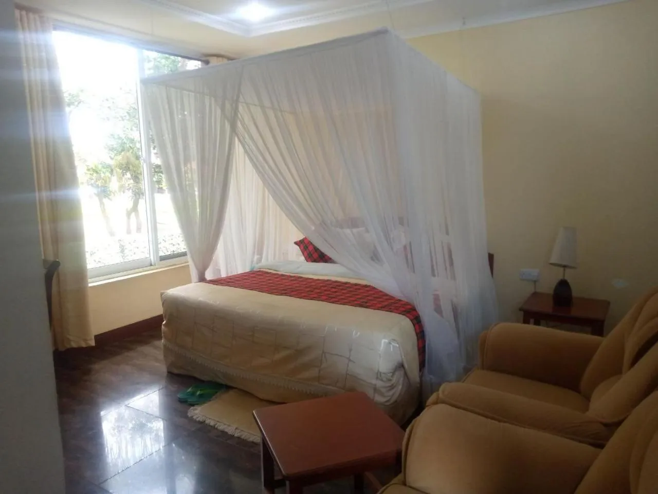 Bed in Karibu Heritage House