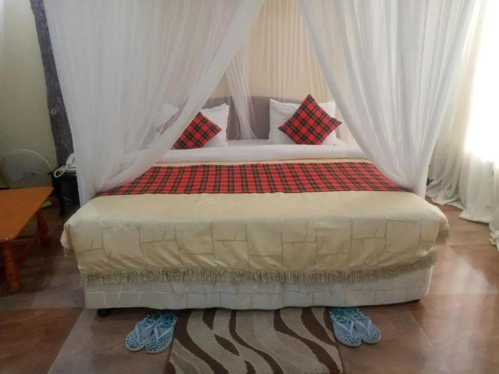 Bed in Karibu Heritage House