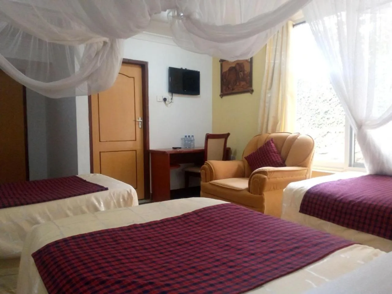 Bed in Karibu Heritage House