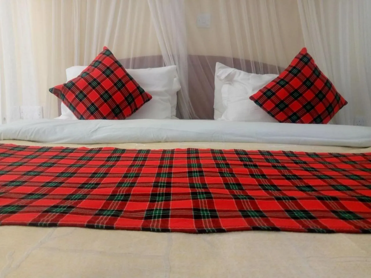 Bed in Karibu Heritage House