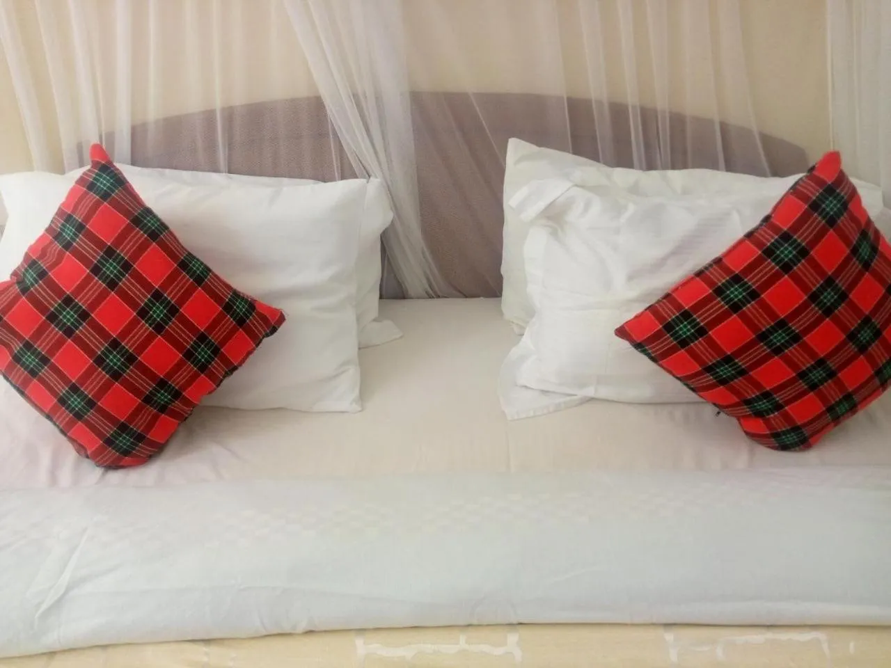 Bed in Karibu Heritage House