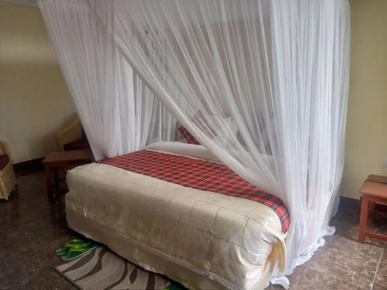 Bed in Karibu Heritage House