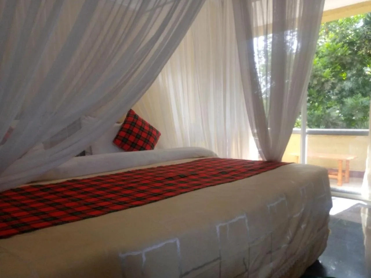 Bed in Karibu Heritage House