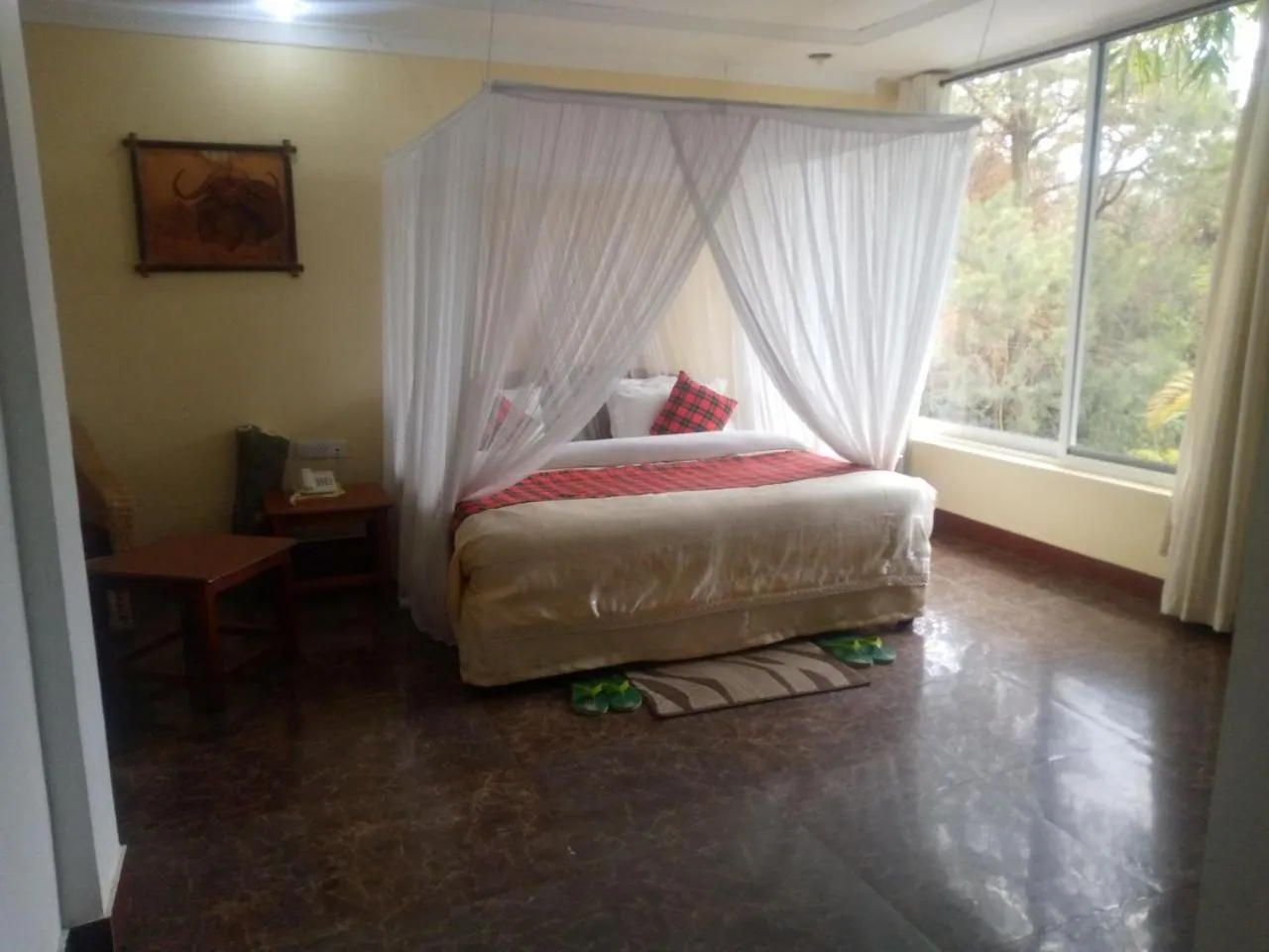 Bed in Karibu Heritage House