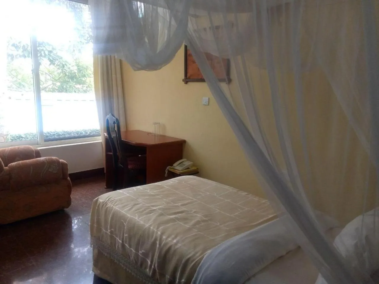 Bed in Karibu Heritage House