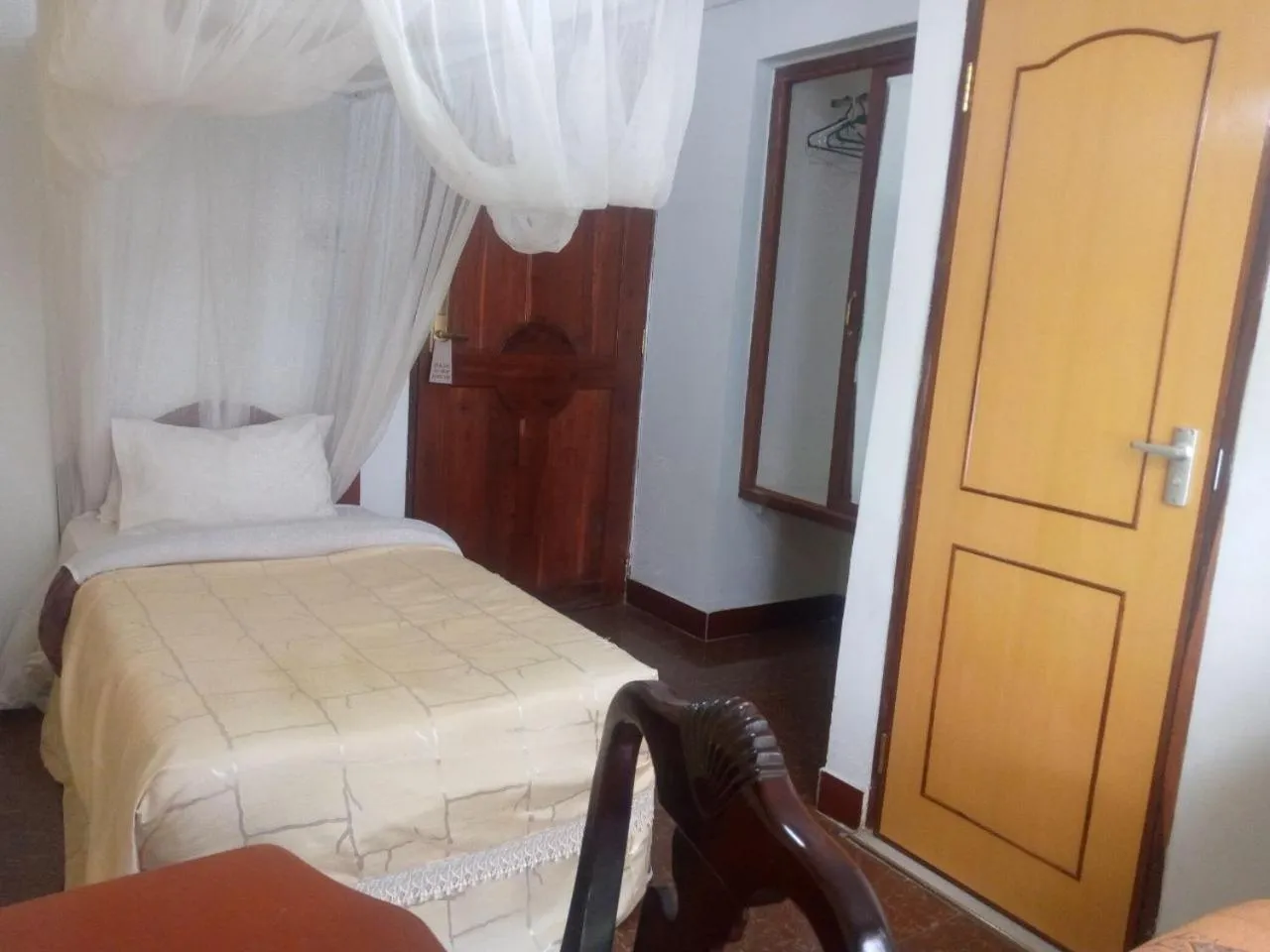 Bed in Karibu Heritage House