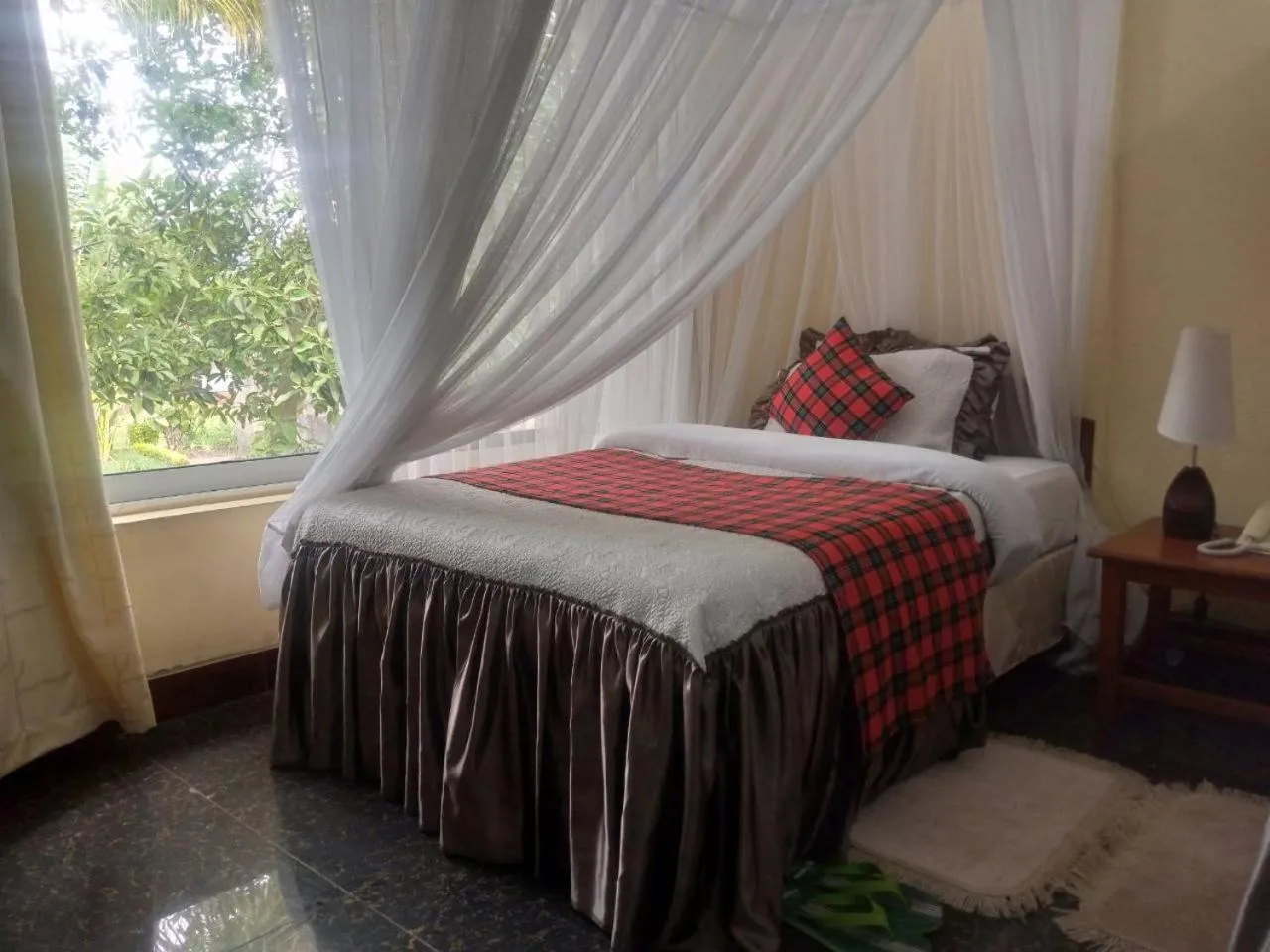 Bed in Karibu Heritage House