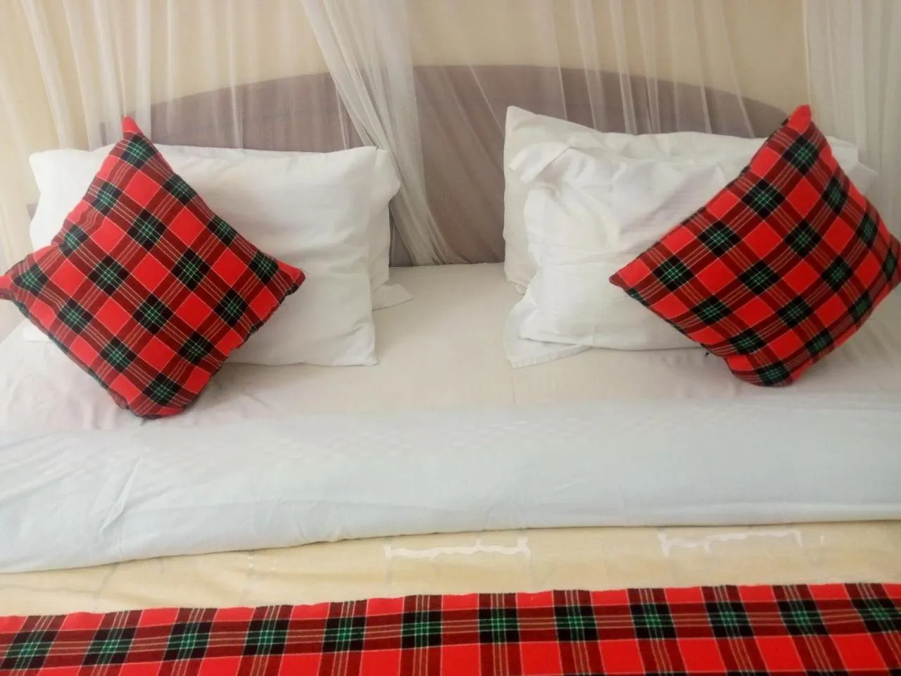 Bed in Karibu Heritage House