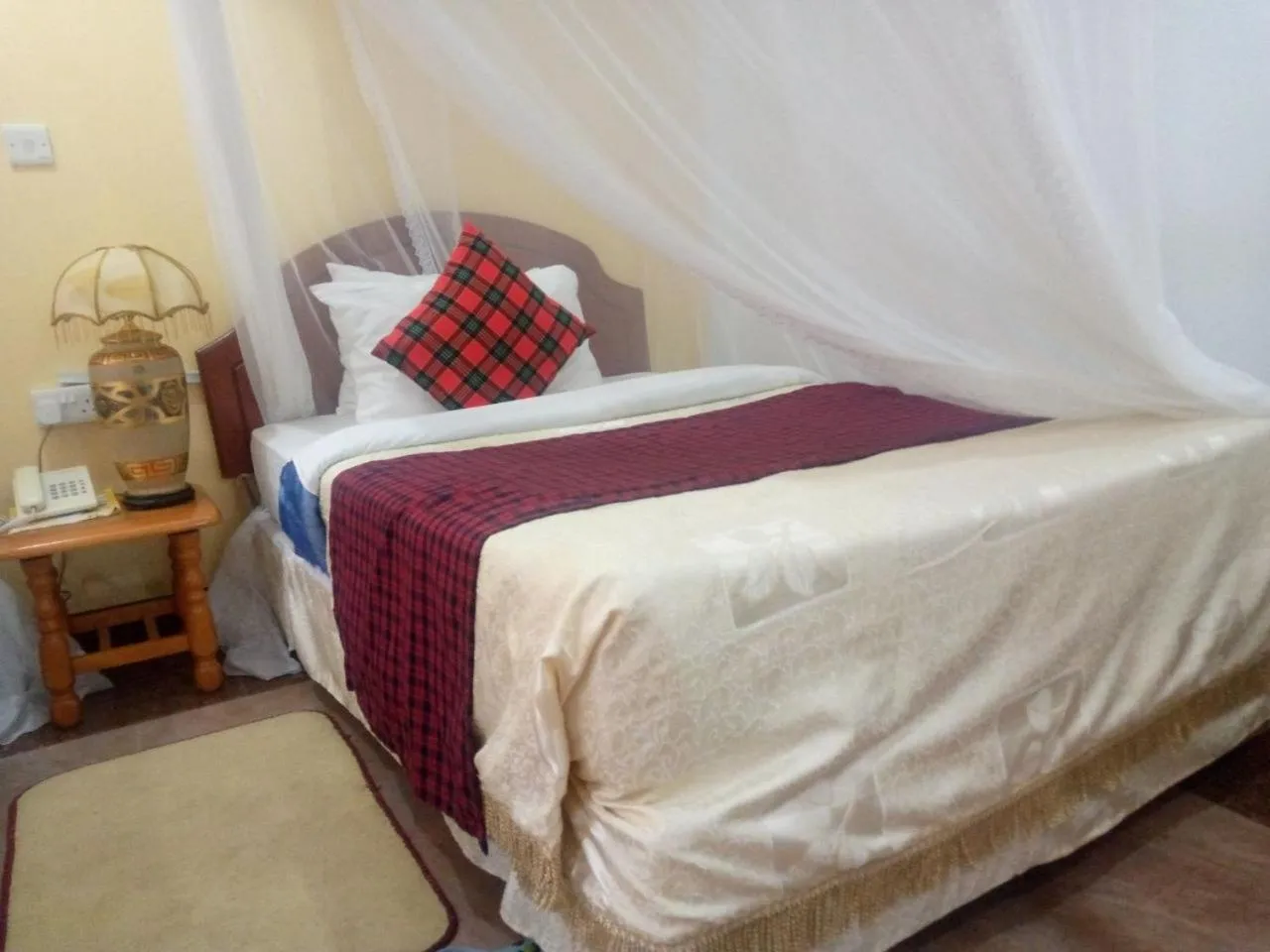 Bed in Karibu Heritage House