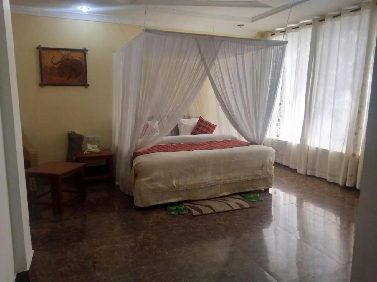 Bed in Karibu Heritage House