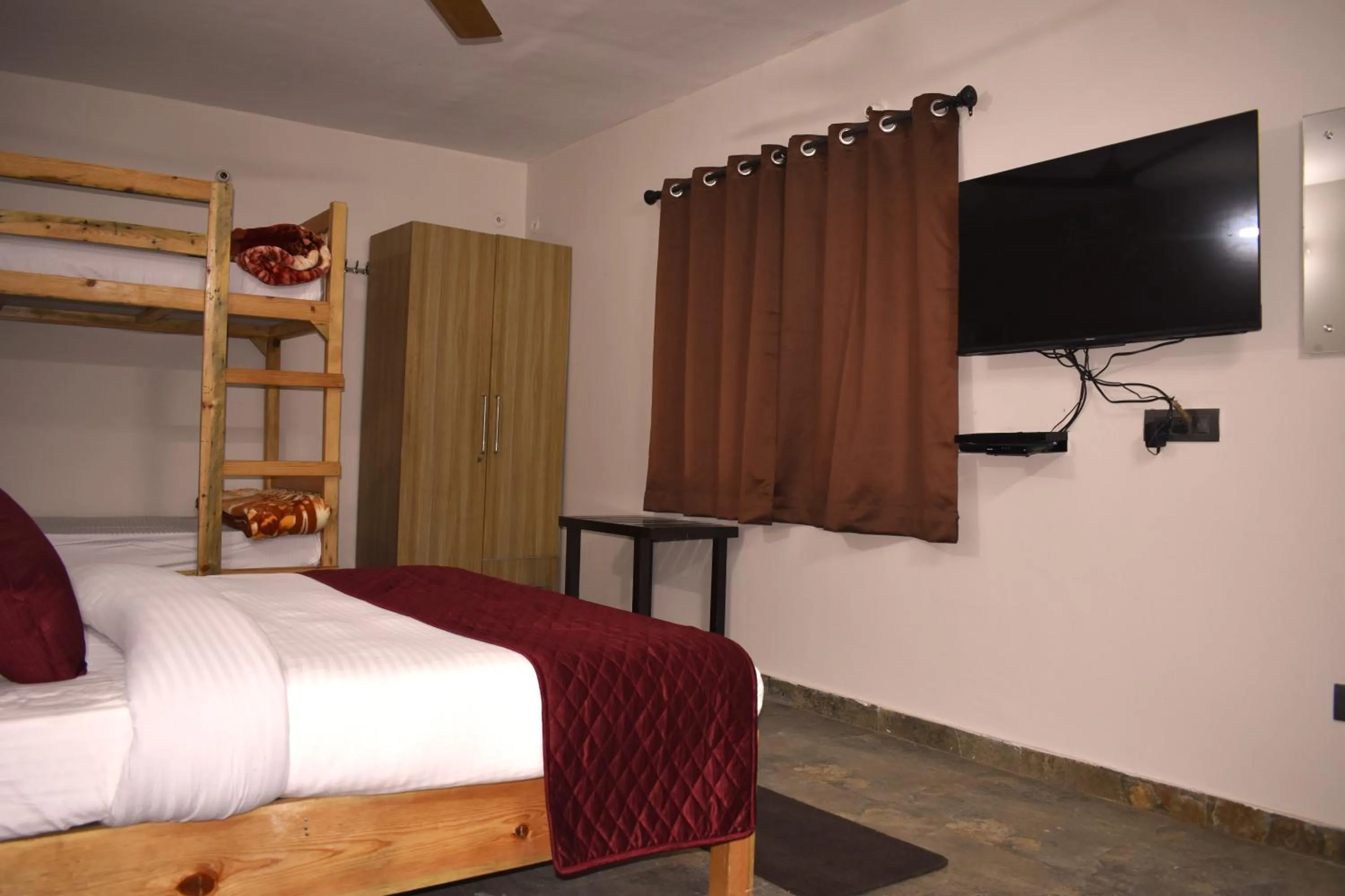 Bed in Captains Paradise Luxury Resort at Mukteshwar Hill Station