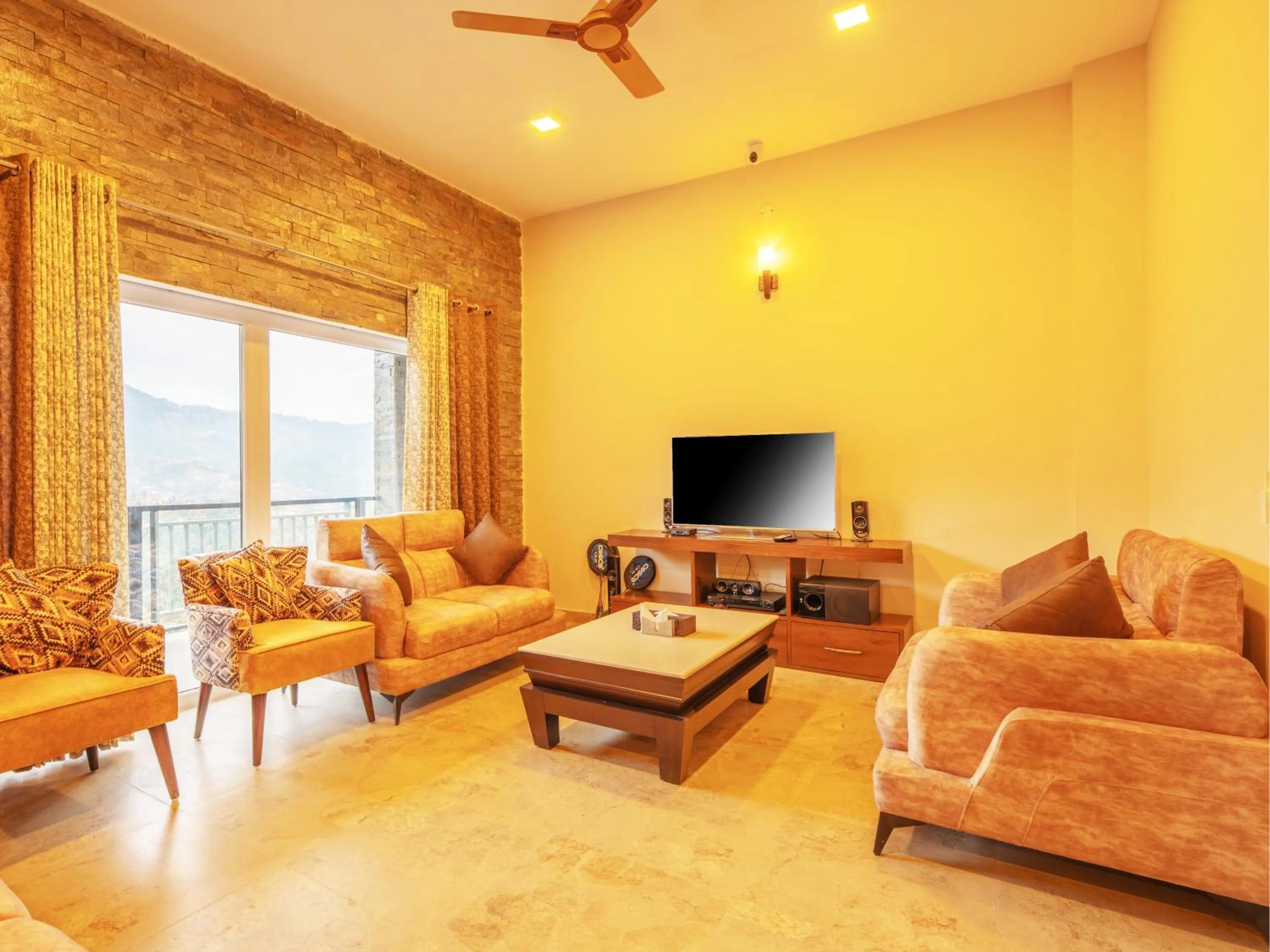 Communal lounge/ TV room in Captains Paradise Luxury Resort at Mukteshwar Hill Station