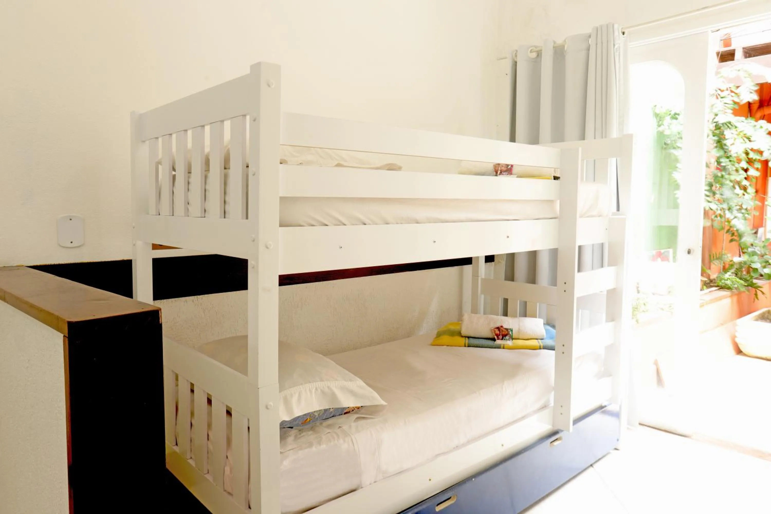 Bed in POUSADA AMENDOEIRA