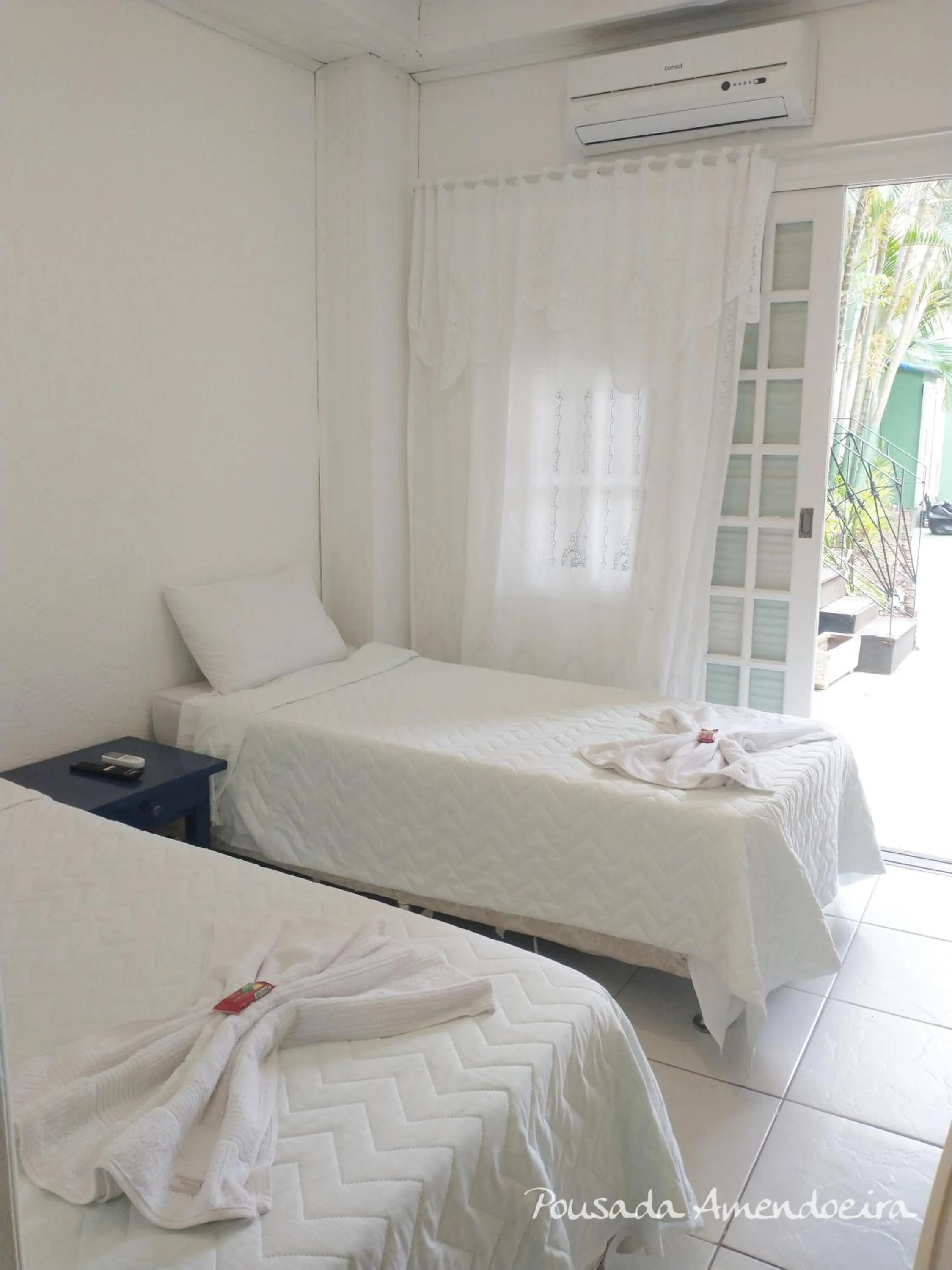 Bed in POUSADA AMENDOEIRA