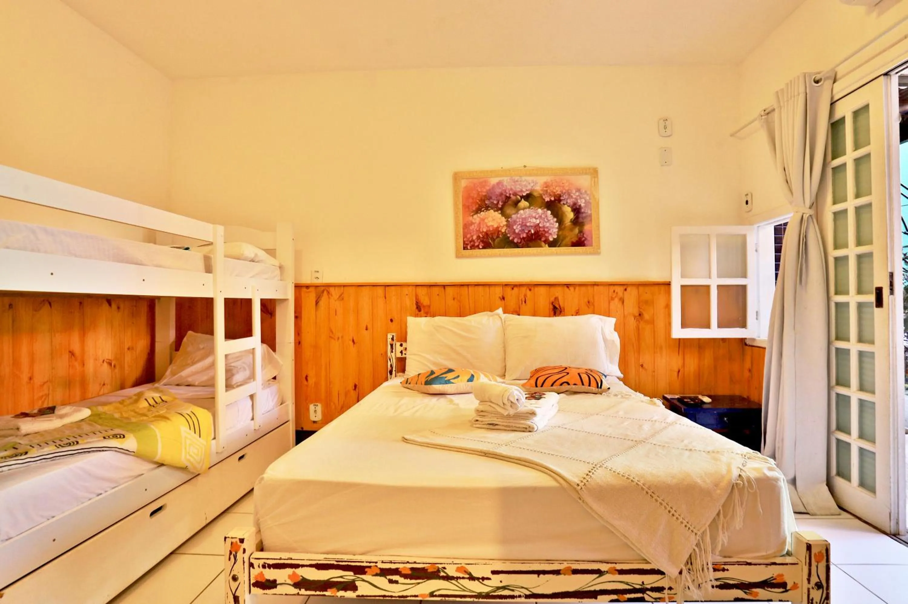 Photo of the whole room, Bed in POUSADA AMENDOEIRA