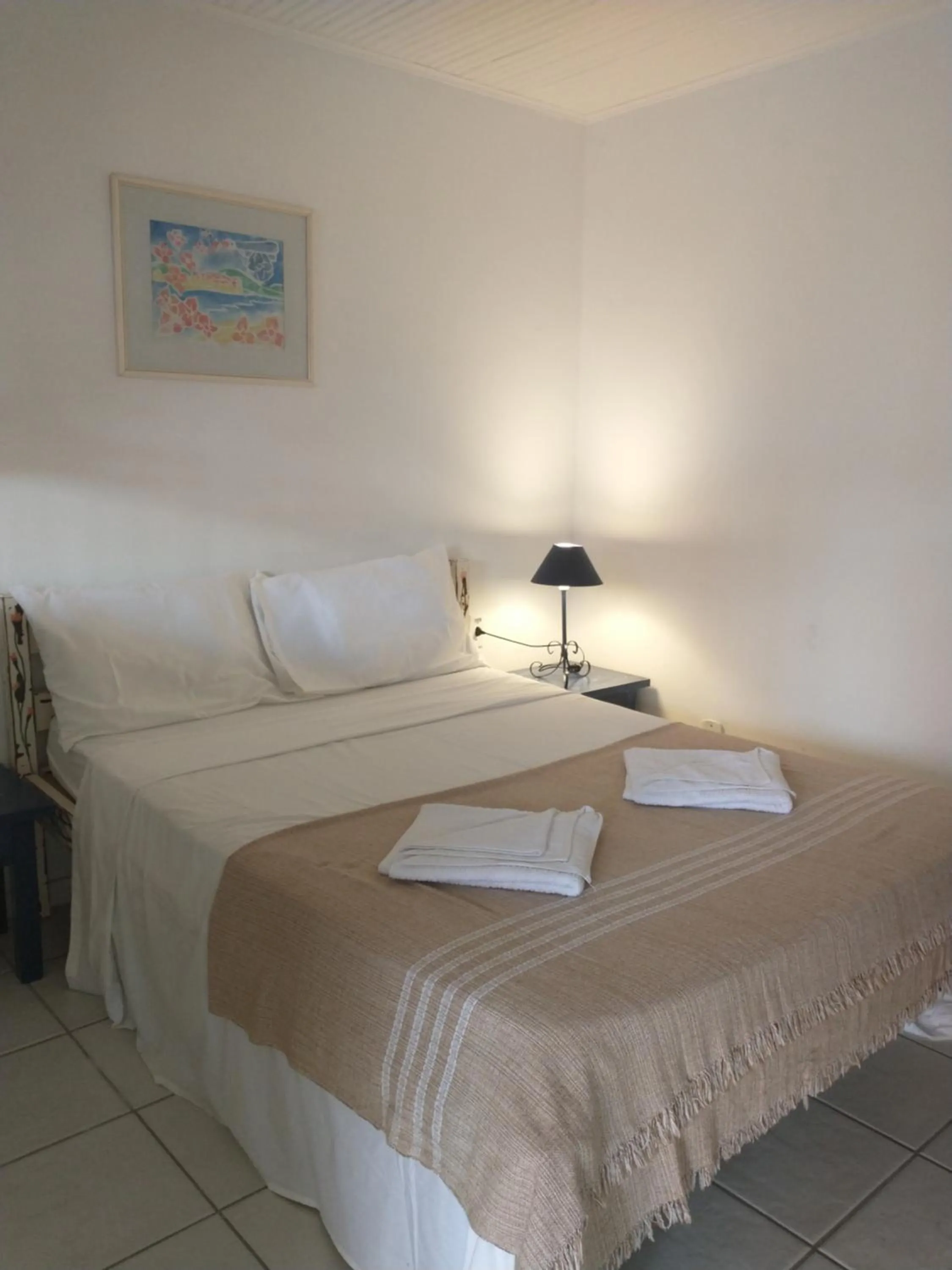 Bed in POUSADA AMENDOEIRA